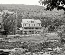 Greene County, N.Y., circa 1902. "Palenville Hotel, Catskill Mountains." 8x10 inch dry plate glass negative, Detroit Publishing Company. View full size.
&amp; Sons AleCan anyone make out the rest?
Rock StarThat dry fit stone wall is a work of art. It reminds me of a favorite children's book, "Matthew Wheelock's Wall," that chronicles the building and graceful endurance of a northeastern farmer's stone fencerow.  It is a beautiful allegory about craftsmanship and mutual support. I think some remaining stone fencerows in the U.S. are preserved as historical and cultural  sites, as many are in Great Britain.
Relax !Looks like a great place to practice your summertime porch sitting ! 
The  Rock WallAlso known in western Pennsylvania as a 'Frost Wall,' will shift and move with the freeze thaw cycles of winter. That's a beauty of stone fence there. 
Is this it?The photo might be from the other side with the creek in the foreground -- the stone wall might be on the edge of the rocks in the crek. The ground pattern doesn't exactly match but it's hard to tell with thick forest in the photo and just a few trees now. The roofline and window patterns seem like a close match.

(The Gallery, DPC)