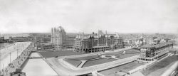 1907. "Atlantic City boardwalk and attractions." Including Young's Million-Dollar Pier and the Hotel Marlborough-Blenheim (Marlborough House at center and the domed Blenheim to the left). Panorama made from two 8x10 glass negatives. Detroit Publishing Co. View full size.
Brighton ParkI'm  happy to see the little park next to the hotel is still there, even though the lovely old hotel has been replaced by an ugly monstrosity, Bally's Park. 
I have wonder what the architects of said monstrosity would say to me. Maybe they would remind me that Bally's allows many more people to have an ocean view and that wood, stone and stucco are not viable choices for skyscrapers. To Bally's credit they kept the smaller Dennis hotel.  Or maybe Atlantic City had something to say about that? 
What an OutrageIn Florida the developers would never allow a vacant piece of land like the park to stay. There must be a condo or hotel there.  We have to put the New Yorkers somewhere!
Charm CityLooking at the 1907 photo in full size, it aches with charm. The architecture, the lawns, and crowds are almost idyllic. 1907 was, indeed, a time of prosperity and tranquility in the United States. It would be another 10 years before we entered WWI while the Spanish Flu killed 675,000 Americans.  
Regardless of wars and disease, the Atlantic City of 1907 was doomed. Here is what this section of the boardwalk looks like today. The pin drop is on Brighton Park. You have beach on one side, and almost nonstop kitschy retail on the other.
Click to embiggen.

(Panoramas, Atlantic City, DPC, Swimming)
