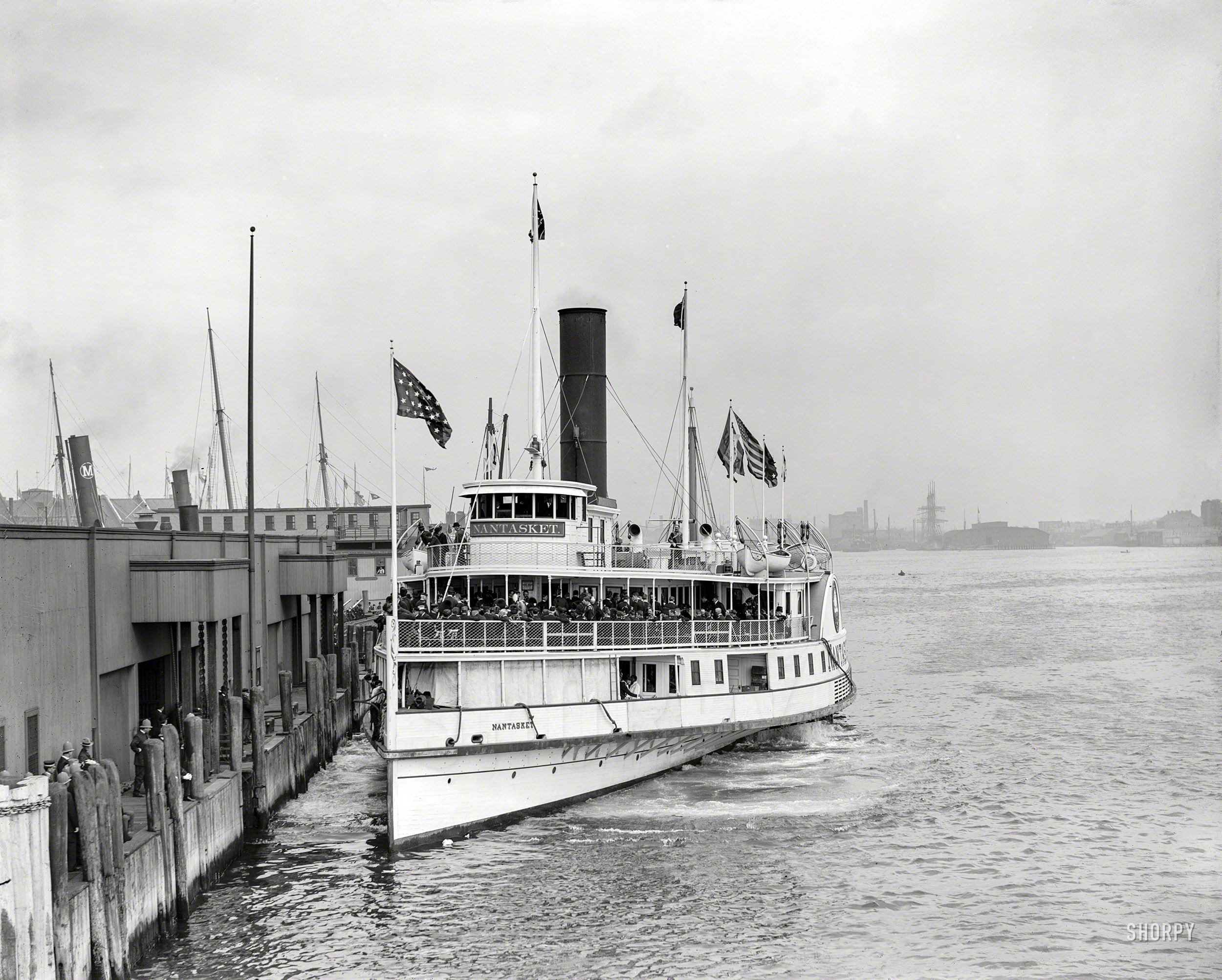 Boston circa 1903. "London Ancients and Honorables leaving Rowe's wharf on steamer Nantasket for harbor trip." 8x10 glass negative. View full size.