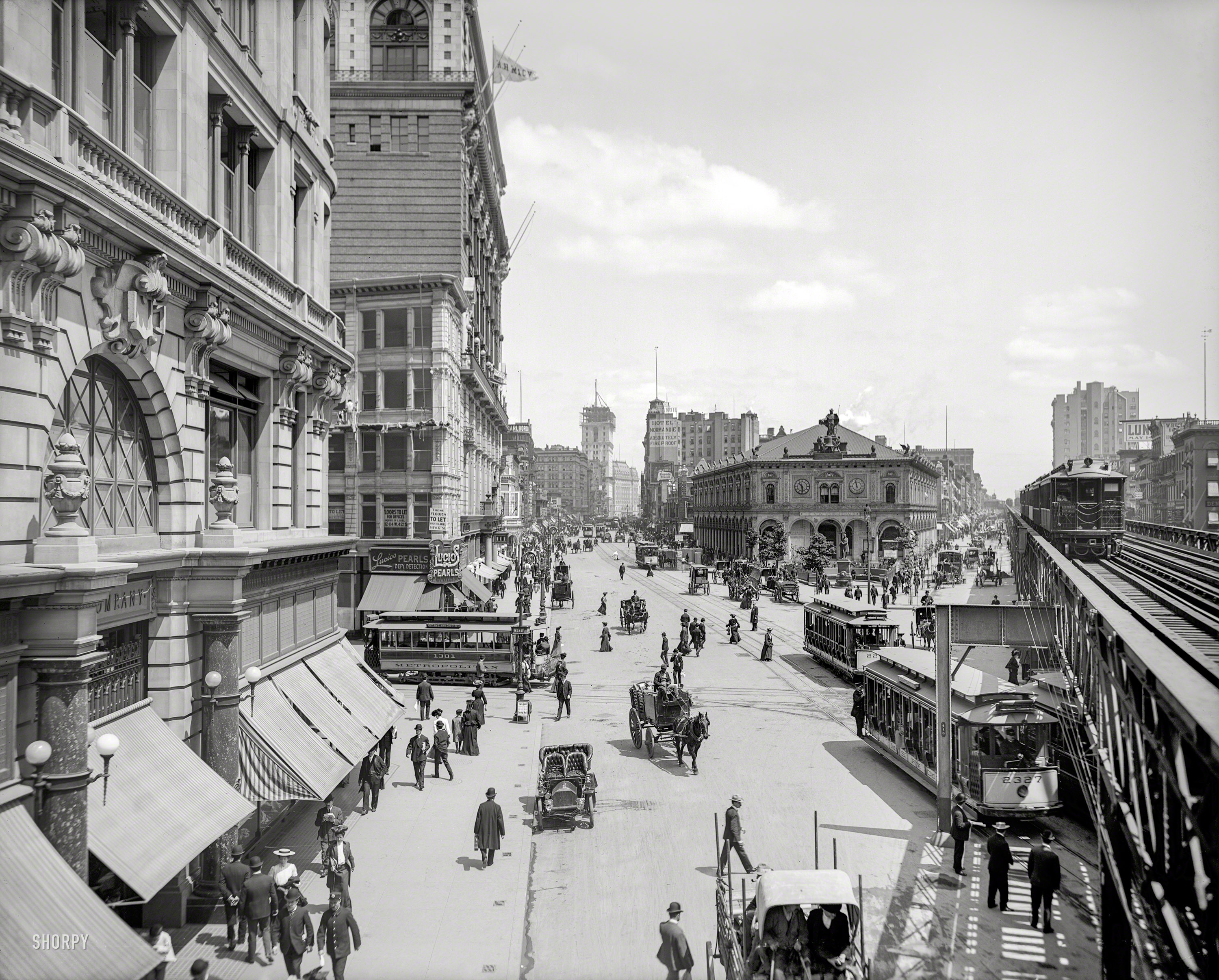 Circa 1903. "Herald Square, New York." With Times Square in the distance, and the New York Times building going up at center. Other landmarks include Macy's, the New York Herald newspaper building, Sixth Avenue elevated tracks and Hotel Astor. 8x10 inch glass negative, Detroit Publishing Company. View full size.