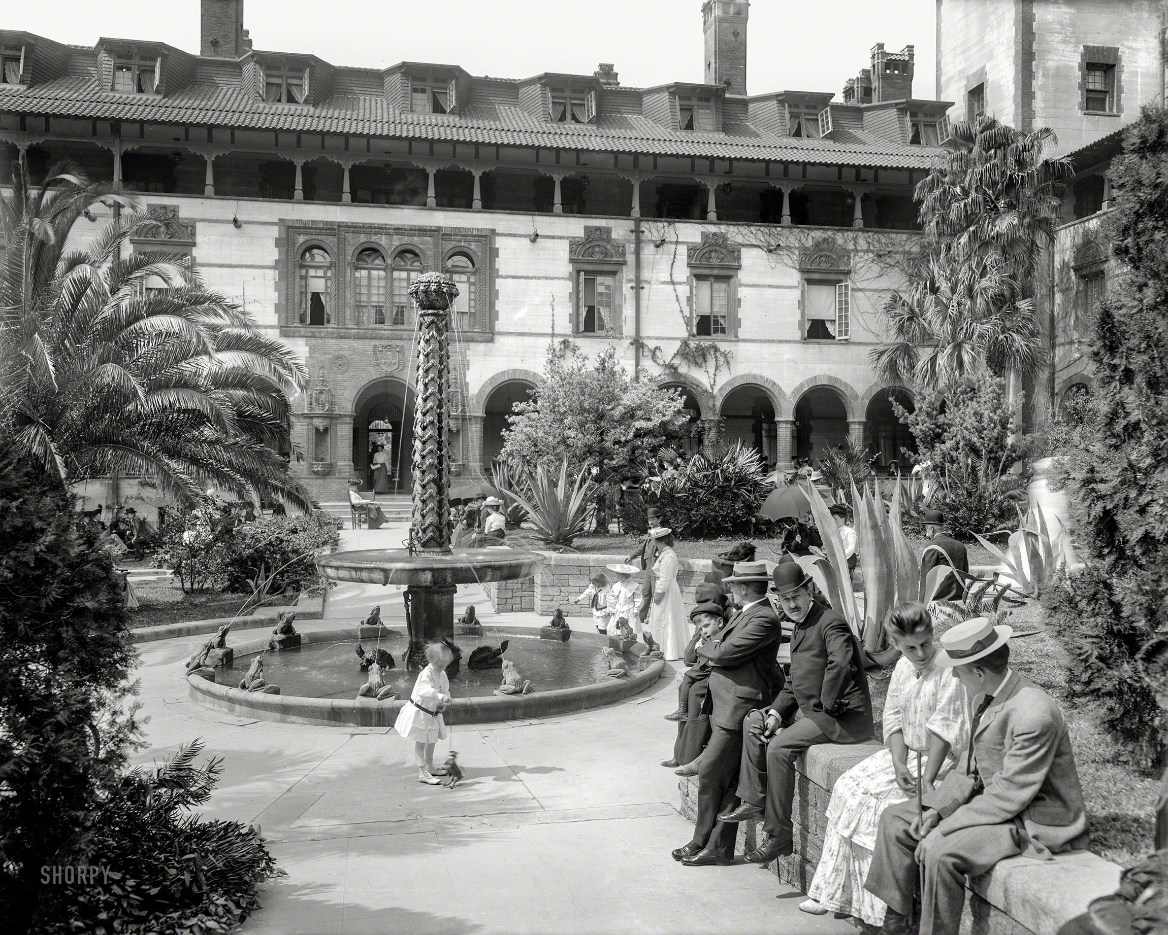 St. Augustine, Florida, circa 1905. "In the court of the Hotel Ponce de Leon." Back at the Frog Fountain. 8x10 inch glass negative, Detroit Photographic Company. View full size.