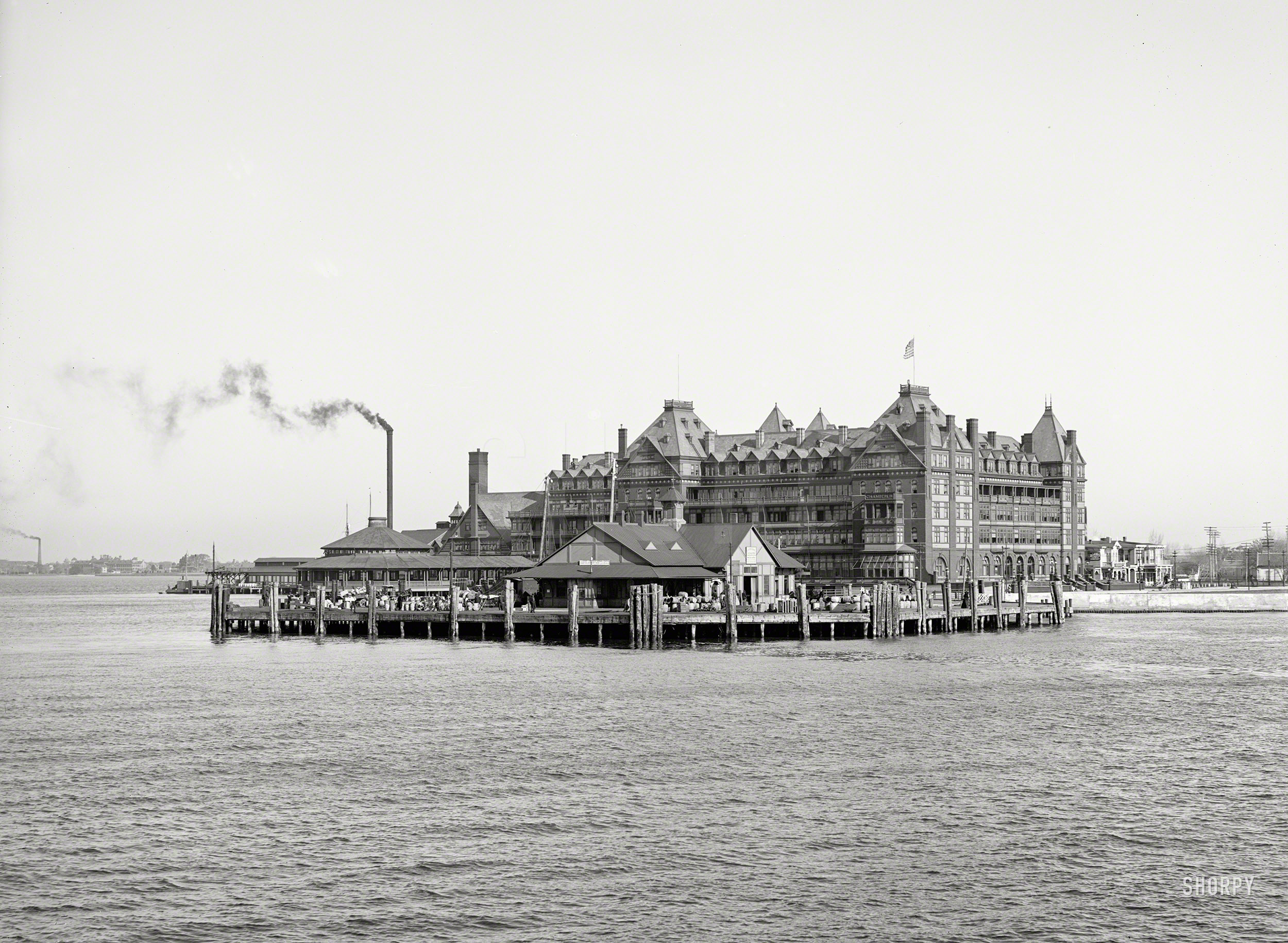 &nbsp; &nbsp; &nbsp; &nbsp; The Chamberlin, a gigantic Queen Anne-style hotel designed by the firm of Smithmeyer and Pelz, architects of the Library of Congress, opened in 1894 and was destroyed by fire in 1920.
1905. "Hotel Chamberlin and government dock, Old Point Comfort, Virginia."  8x10 inch glass negative, Detroit Publishing Company. View full size.