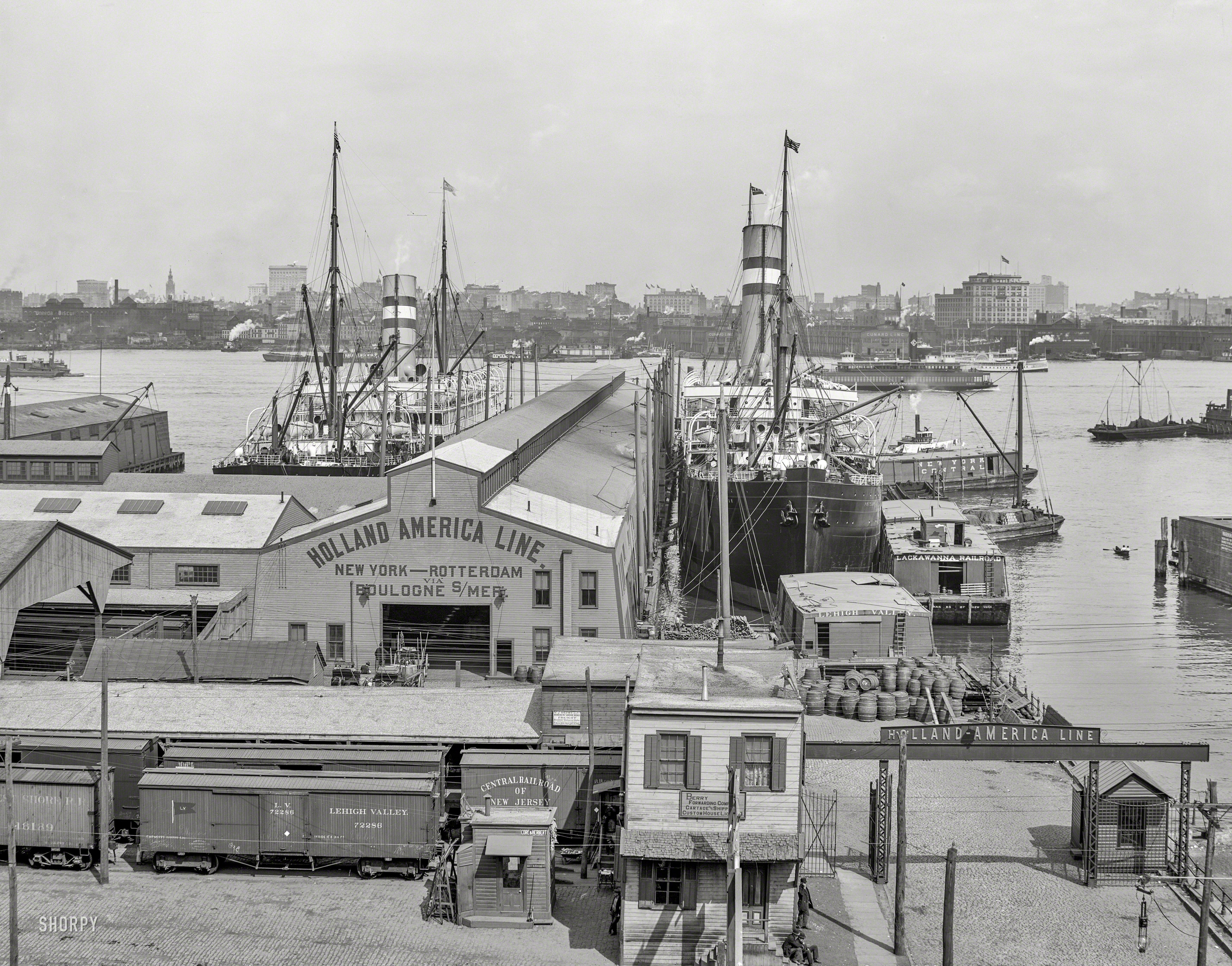Hoboken, New Jersey, circa 1905. "Holland America Piers with view of Manhattan across Hudson River." 8x10 inch dry plate glass negative. View full size.