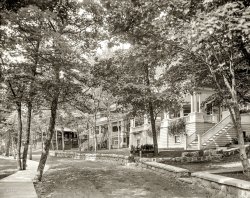 1906. "Cottages at Harbor Springs, Michigan." The resort community in its early years. 8x10 inch glass negative, Detroit Publishing Company. View full size.
Look mighty big to be cottages.More like bed and breakfasts.  Looks like a very pleasant place to be in a pleasant time.
[You've never been to Newport. - Dave]
&quot;Cottages&quot;I always assumed cottages to be small simple houses, typically near a lake or beach. Several years ago, I was a guest for a week at a cottage on Lake Michigan. It was like these, 6 bedrooms, large kitchen and dining room and great room. Built about 1903. However, the bathrooms were rather skimpy.
(The Gallery, DPC)