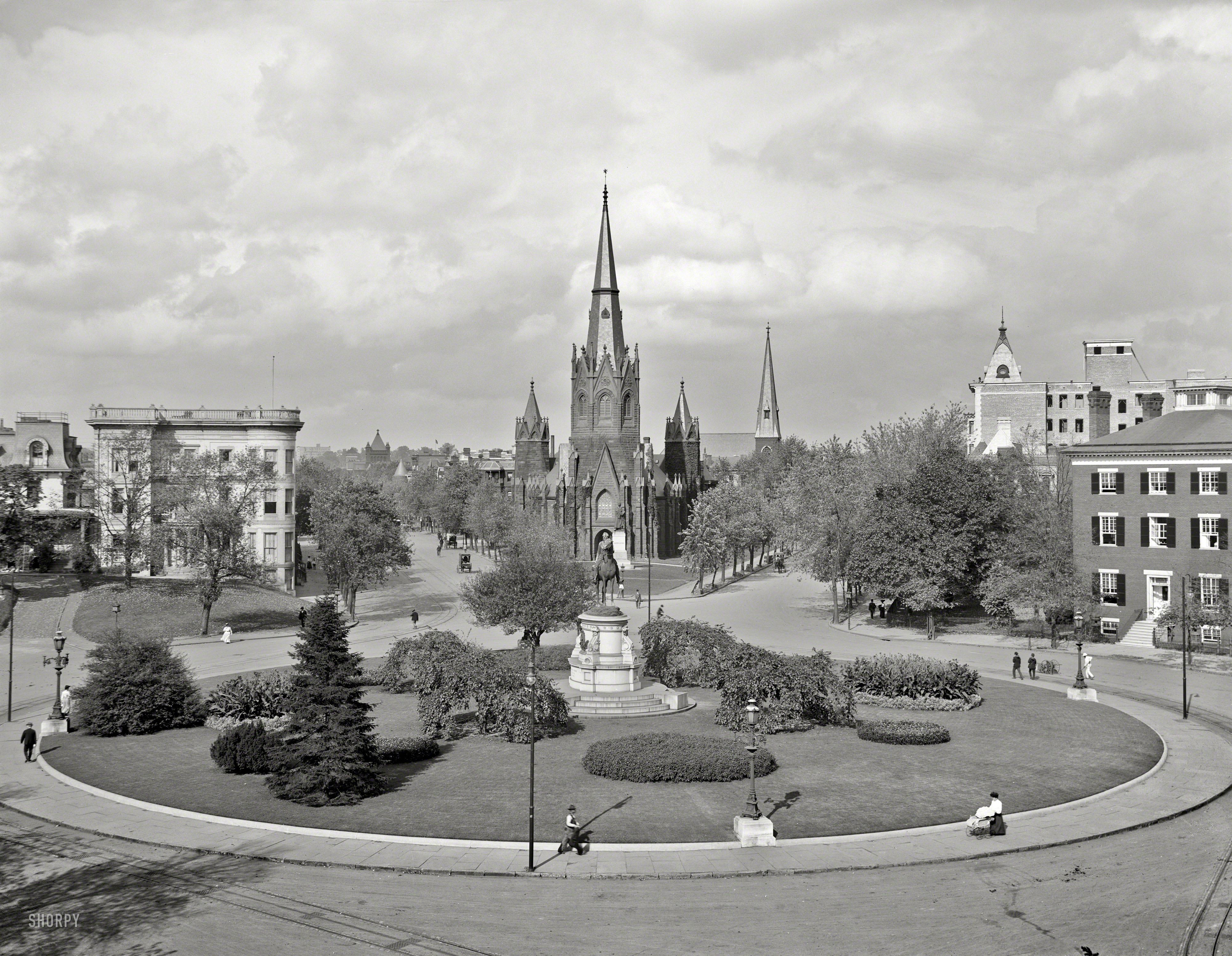 &nbsp; &nbsp; &nbsp; &nbsp; Named for George Henry Thomas, Civil War general and, from his perch on the plinth, observer of countless traffic-circle fender-benders.
Thomas Circle and Luther Place Memorial Church in Washington, D.C., circa 1906. 8x10 inch glass negative, Detroit Publishing Company. View full size.