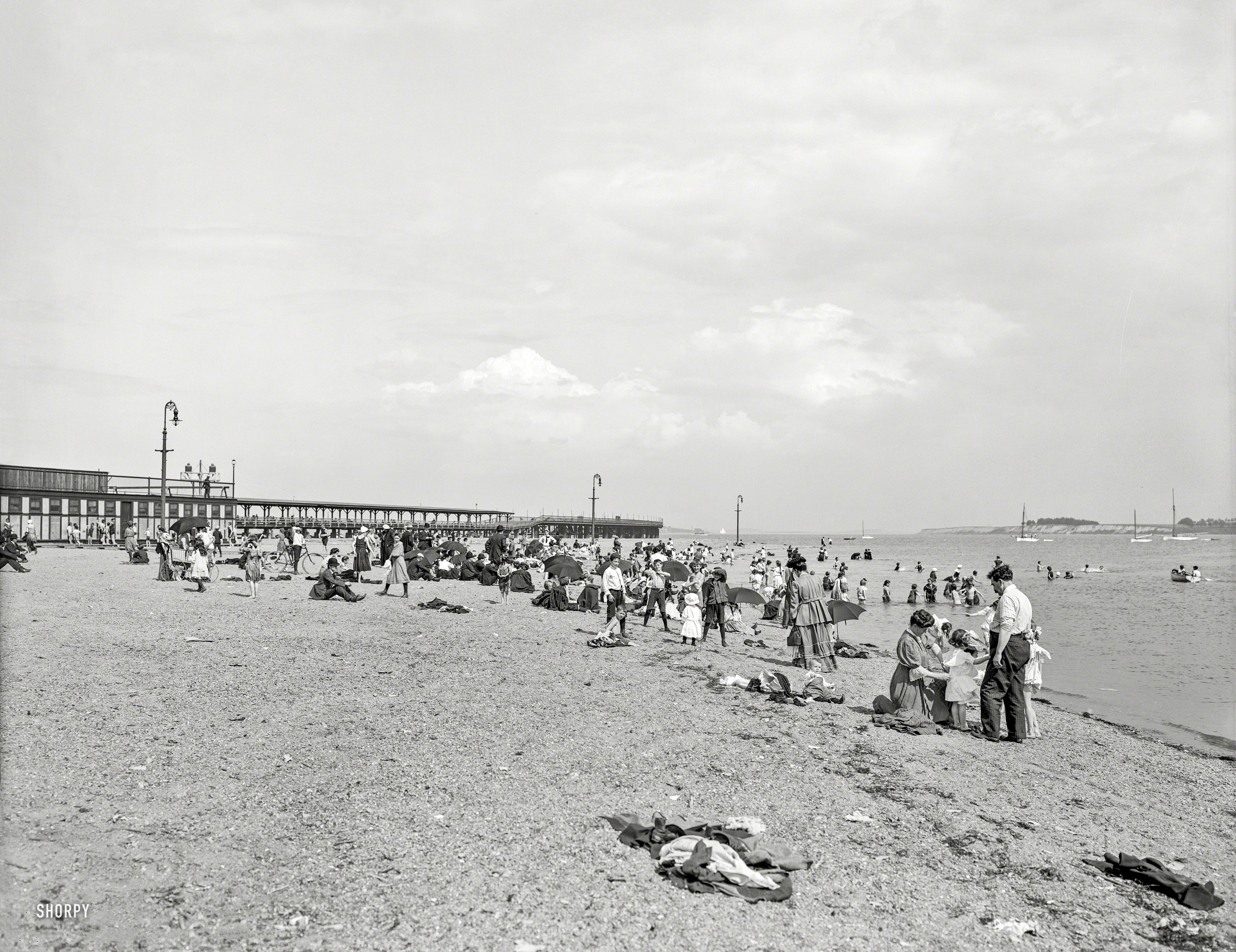 1906. "Bathing at City Point, South Boston, Mass." Hey, kid. Put on a shirt! 8x10 inch dry plate glass negative, Detroit Publishing Company. View full size.