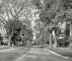 Circa 1907. "Northampton, Massachusetts -- Elm Street." 8x10 inch dry plate glass negative, Detroit Publishing Company. View full size.
Smith CollegeThe tell-tale masonry corner of the St. John's Episcopal Church at far left of this photo helps pinpoint its location, at 48 Elm Street, along the widened modern highway now running along Elm Street. Smith College campus is on the left, with their Student Affairs offices in the big residential looking building next to the church. 
(The Gallery, DPC)