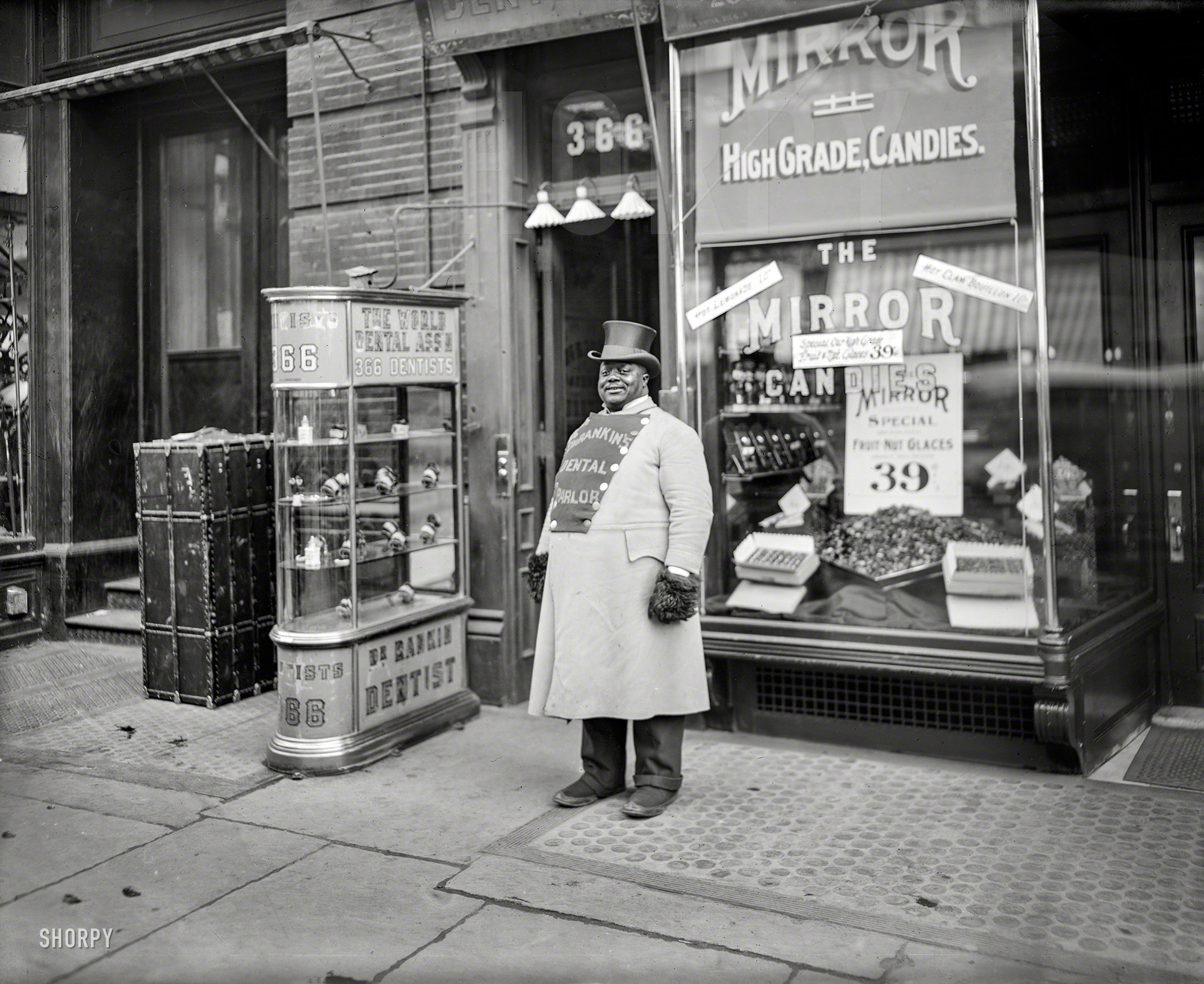 Circa 1905. "A living sign on Fifth Avenue, New York City." Brand ambassador for Dr. Rankin's Dental Parlor, conveniently close to a candy store. View full size.