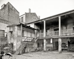 New Orleans circa 1903. "Old Spanish courtyard." Is the bar open yet? 8x10 inch dry plate glass negative, Detroit Publishing Company. View full size.