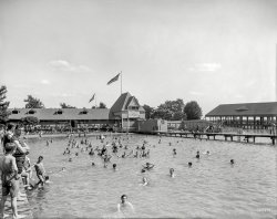 Detroit circa 1903. "Swimming pool, Belle Isle Park, evidently." No girls allowed. 8x10 inch glass negative, Detroit Publishing Company. View full size.
No Girls?As a red blooded teenage young man in the 60's I find the concept of no girls at the pool or the beach highly offensive. I can get wet in my bathtub. You go to the beach/pool to see cute girls in cute bikinis and to do a copious amount of flirting. The thought of a boys only beach is un-American and frankly a little creepy. Just ask Frankie or Annette.
Probably afraidthey'll catch cooties if girls were allowed. 
What&#039;re you lookin&#039; at?Striped suit boy on the extreme left seems very suspicious of the photographer.
Lack of one doesn&#039;t mean lack of the otherNo girls, but there are plenty of bloomers in evidence.
Can't imagine trying to swim in those things.
Loads of funThey didn't seem to miss the girls, though!
(The Gallery, DPC, Swimming)