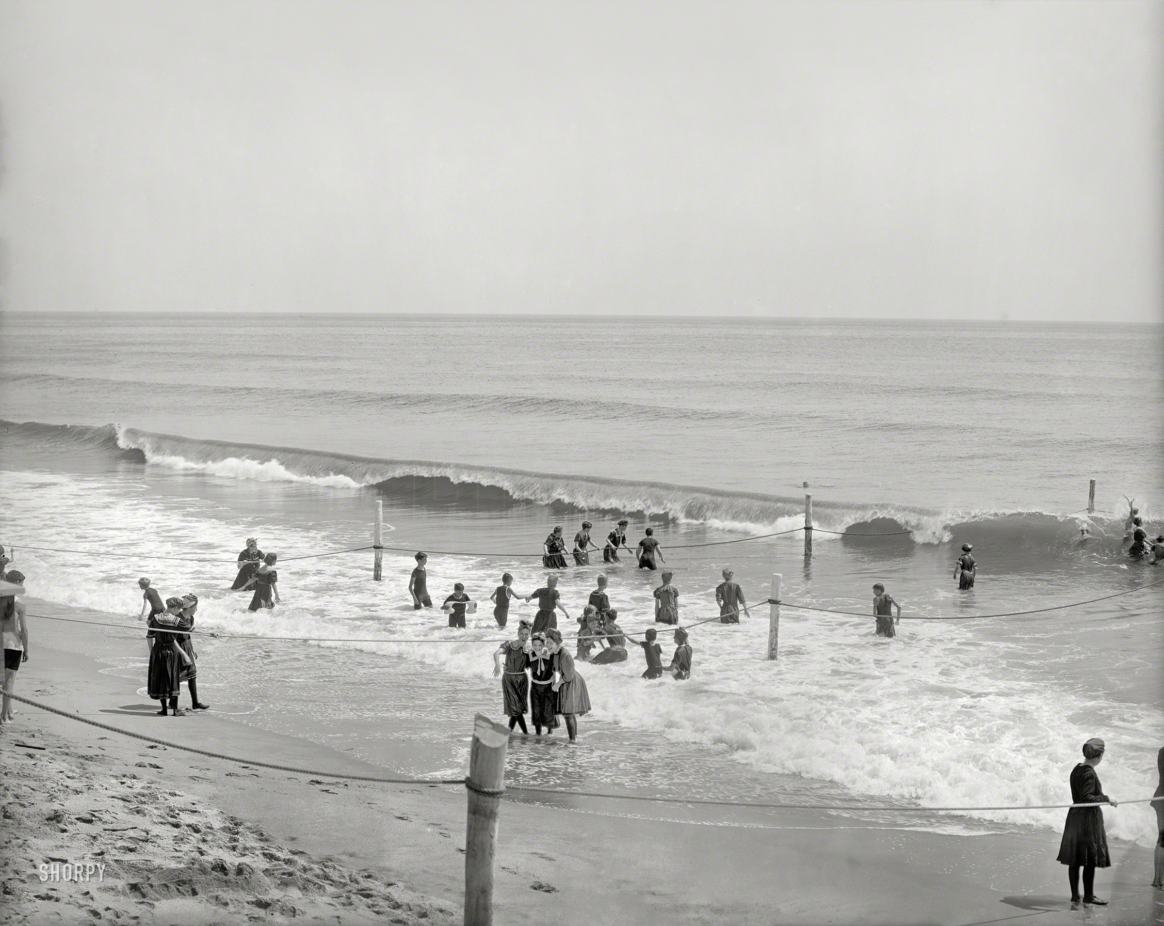 The Jersey Shore circa 1905. "In the surf at Asbury Park." Having a wonderful time; wish we were still here. 8x10 inch dry plate glass negative. View full size.