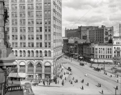 Detroit circa 1907. "A glimpse of Woodward Avenue from City Hall." A slice of the Campus Martius bracketed by the Majestic Building and Michigan Avenue at left, and Detroit Opera House on the right. 8x10 inch glass negative, Detroit Publishing Company. View full size.