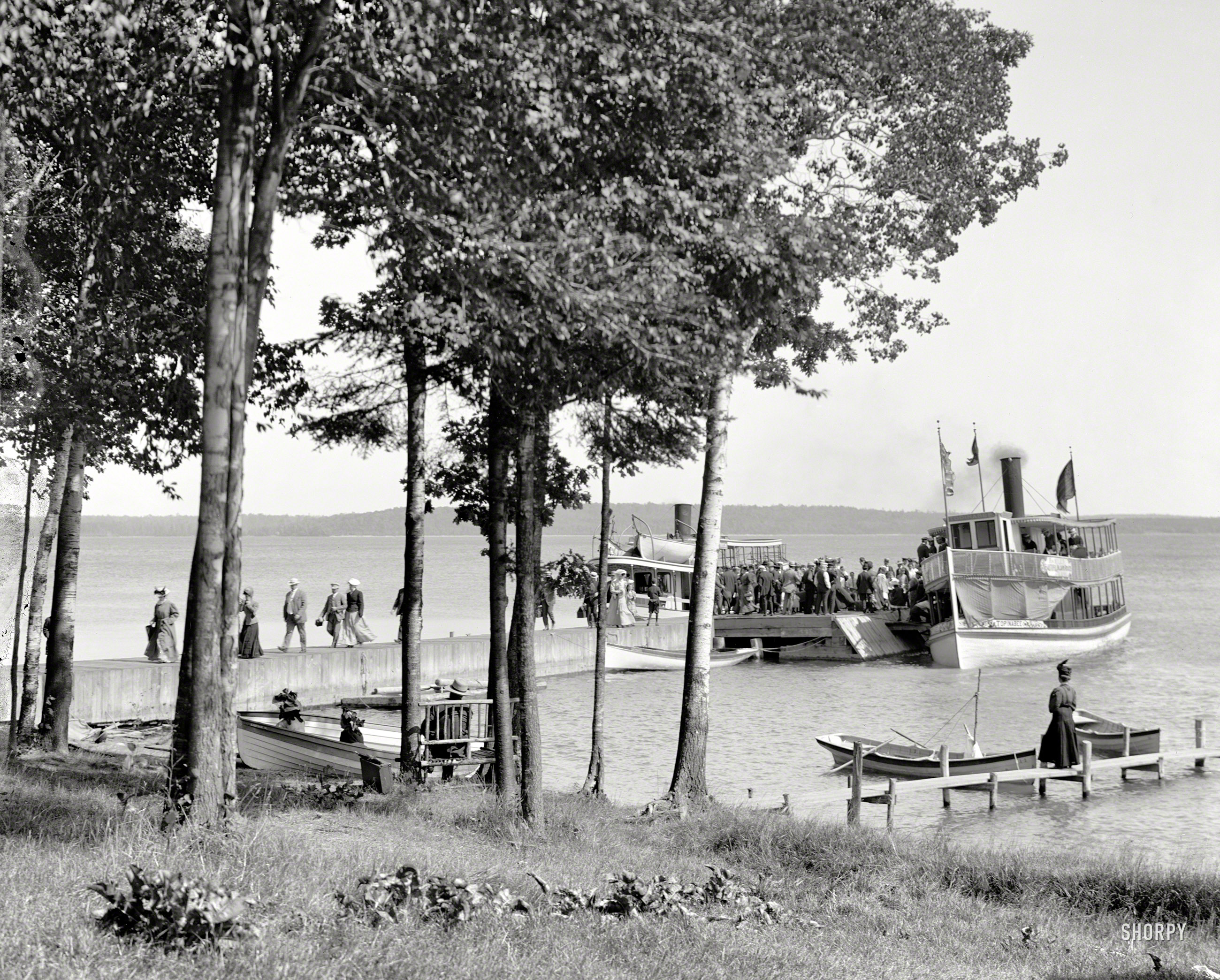 Circa 1910. "Topinabee Landing, Hamill's Inland Route, Cheboygan-Petoskey, Michigan." Excursionists on the dock, just in from an outing. View full size.
