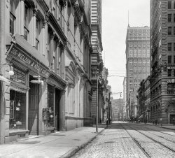 Pittsburgh, Pennsylvania, circa 1908. "Wood Street, looking east." Showing a rare example of the Edison Spigot. 8x10 inch glass negative. View full size.