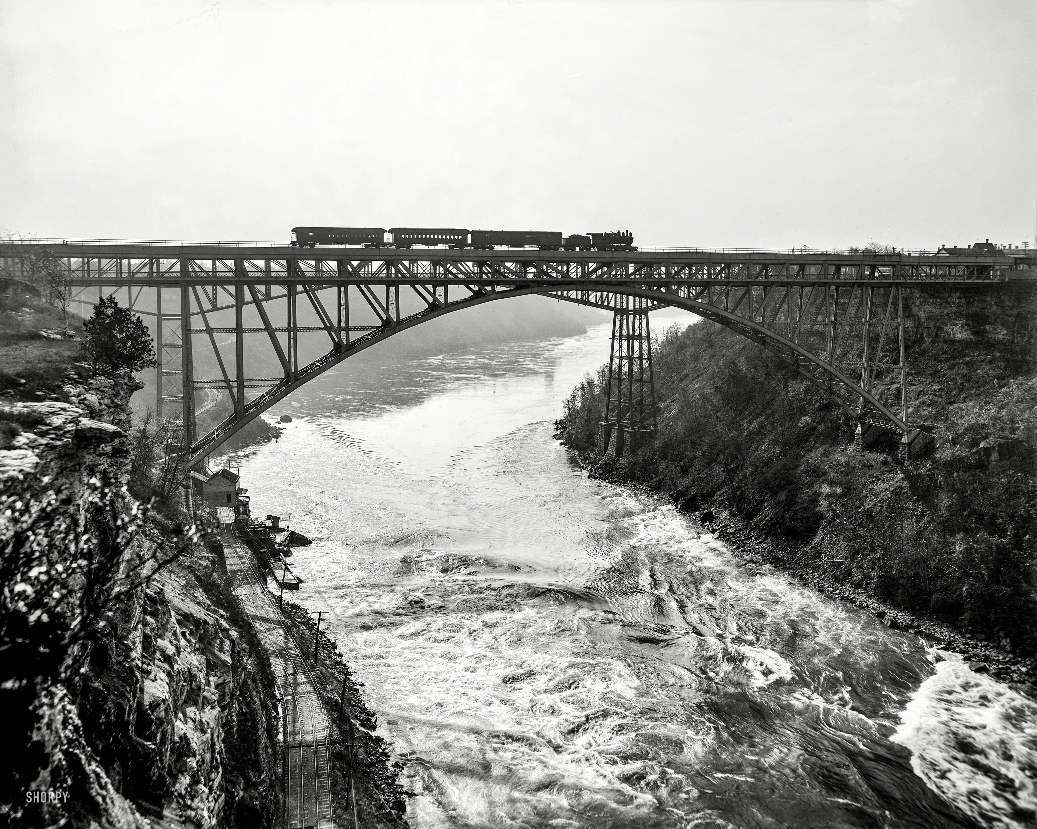 Circa 1900. "Niagara Falls, New York. Whirlpool Rapids (Grand Trunk Railway) Bridge with Michigan Central Cantilever Bridge in background." 8x10 inch dry plate glass negative, Detroit Publishing Company. View full size.