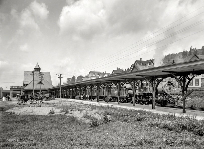 Circa 1905. "Saranac Lake central station, Adirondacks, N.Y." With a locomotive of the Delaware &amp; Hudson Railway. 8x10 inch glass negative. View full size.
