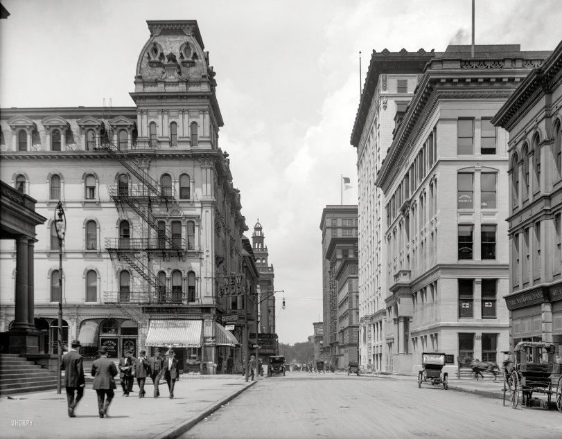 Toledo, Ohio, circa 1909. "Madison Avenue." Fast-forward a few years from our previous view of downtown Toledo and we now have automobiles and a "New Boody." Which if you ask us looks very much like the Old Boody. View full size.
