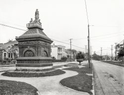 New Orleans circa 1910. "Gayarre Place monument, Esplanade Avenue." In its current incarnation, the monument's much-abused sculpture ("Peace, the Genius of History," originally displayed at the 1884 World's Industrial and Cotton Centennial Exposition) has regained an arm but lost the cherubs. 8x10 inch dry plate glass negative, Detroit Publishing Company. View full size.