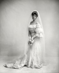 Circa 1910. "Woman in wedding dress holding flowers." 8x10 inch dry plate glass negative, Detroit Publishing Company. View full size.