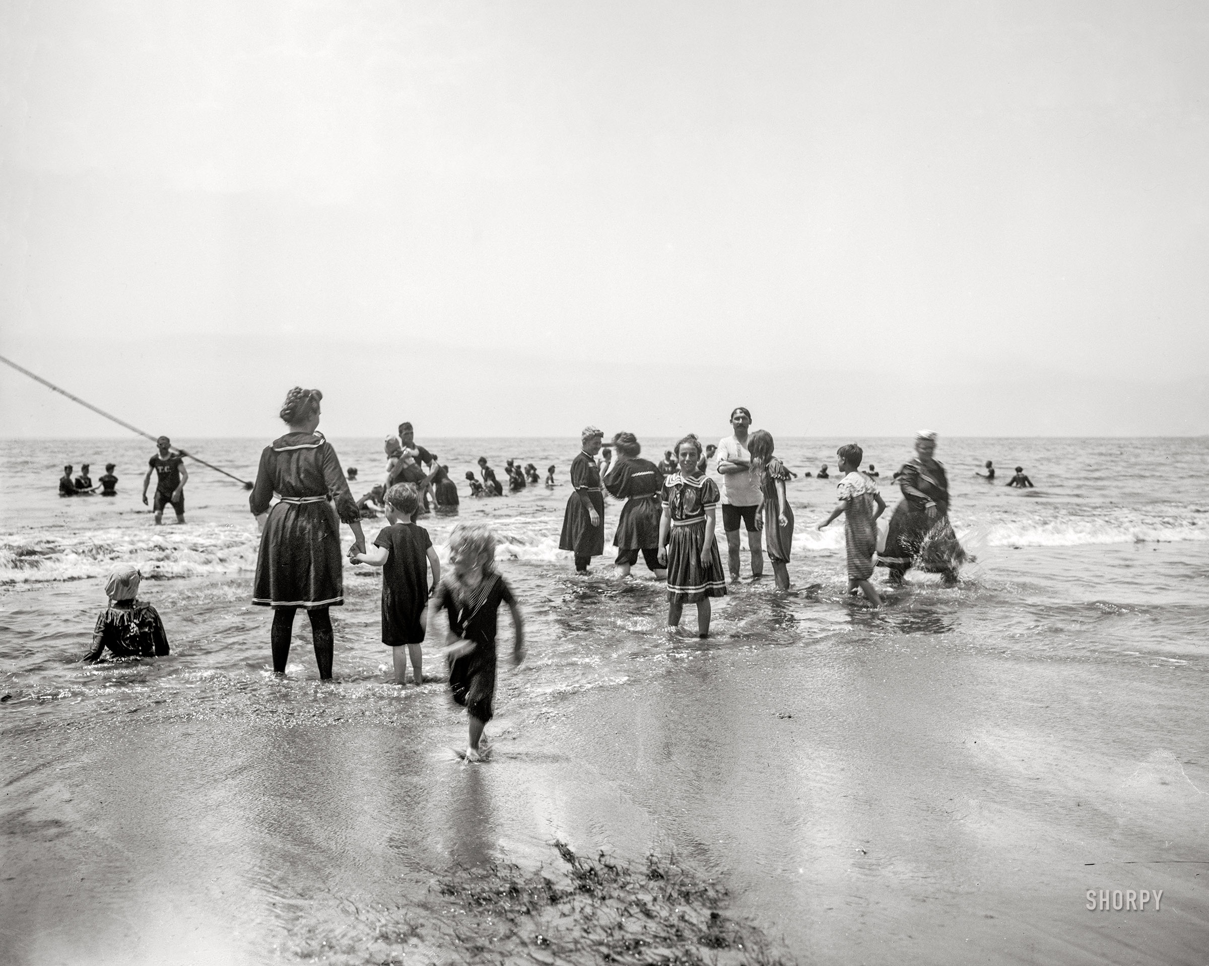 "Surf bathing" is the caption for this circa 1905 photo taken somewhere along the Atlantic Coast. 8x6 inch dry plate glass negative, Detroit Photographic Company. View full size.