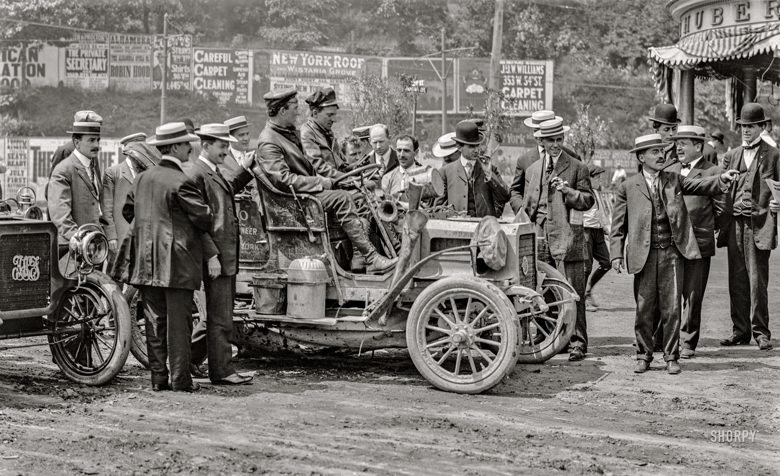 June 1906. "REO Mountaineer, New York to San Francisco and back." Percy Megargel and David Fassett at Huber's Hotel on 162nd Street in the Bronx at the end of their 10-month, 11,000-mile trip in a 16-horsepower REO (Ransom E. Olds) touring car. View full size.