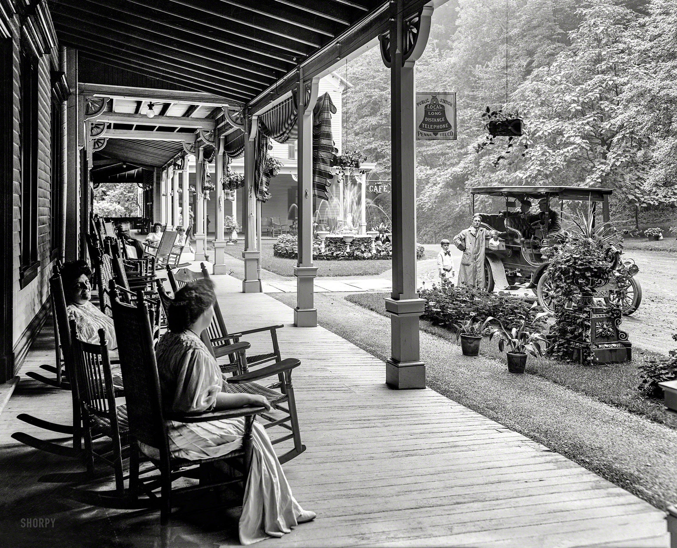 Circa 1905. "Front piazza of Kittatinny House, Delaware Water Gap, Pennsylvania." An up-to-date inn catering to the automobilist with such amenities as cafe and public telephone. 8x10 inch glass negative. View full size.