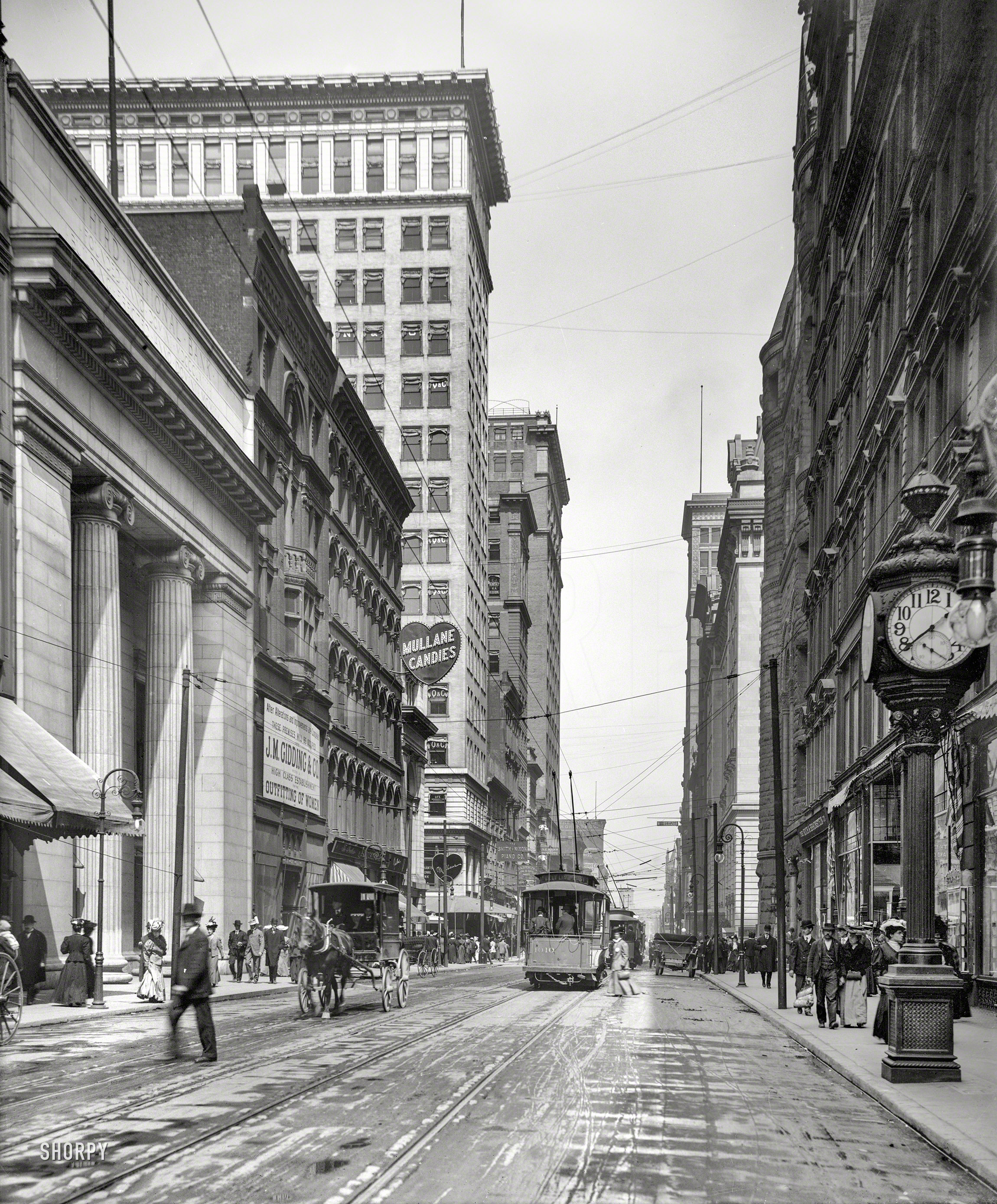 Circa 1907. "Fourth Street, Cincinnati, Ohio." Where the brands vying for your trade include Mullane and Wurlitzer.  8x10 glass negative. View full size.