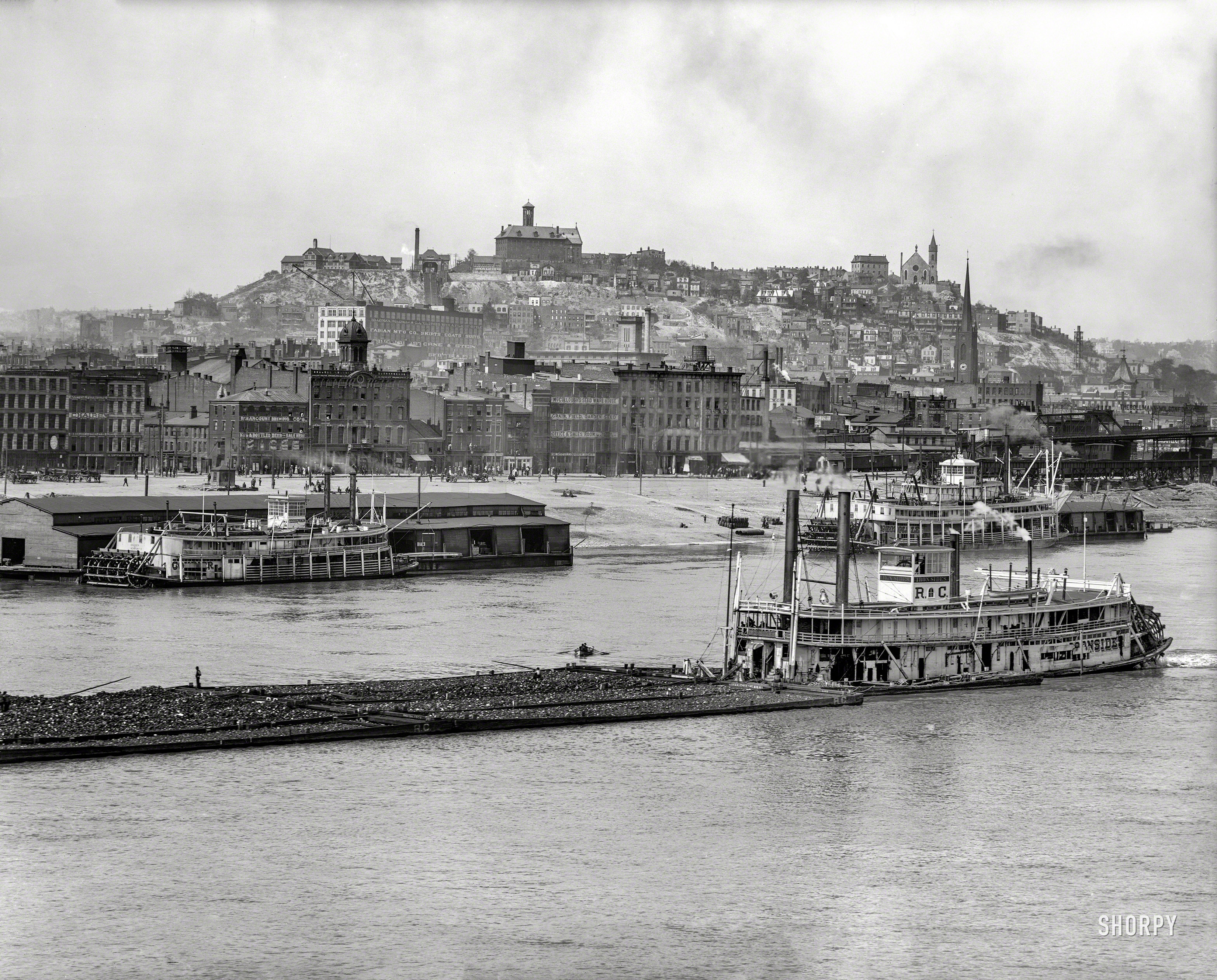 Circa 1907. "Cincinnati -- Mount Adams across Ohio River from Covington, Kentucky." With a view of the sternwheeler Iron Sides pushing a coal barge. 8x10 inch dry plate glass negative, Detroit Publishing Company. View full size.