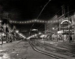 Niagara Falls, New York, circa 1908. "Falls Street at Night." A scene last glimpsed here. Note the ghost streetcar stopped mid-frame in this time exposure. 8x10 inch dry plate glass negative, Detroit Publishing Company. View full size.