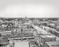 Lansing, Michigan, circa 1907. "Bird's-eye view from tower -- State Capitol and Michigan Avenue over Grand River."  8x10 inch glass negative, Detroit Publishing Co. View full size.