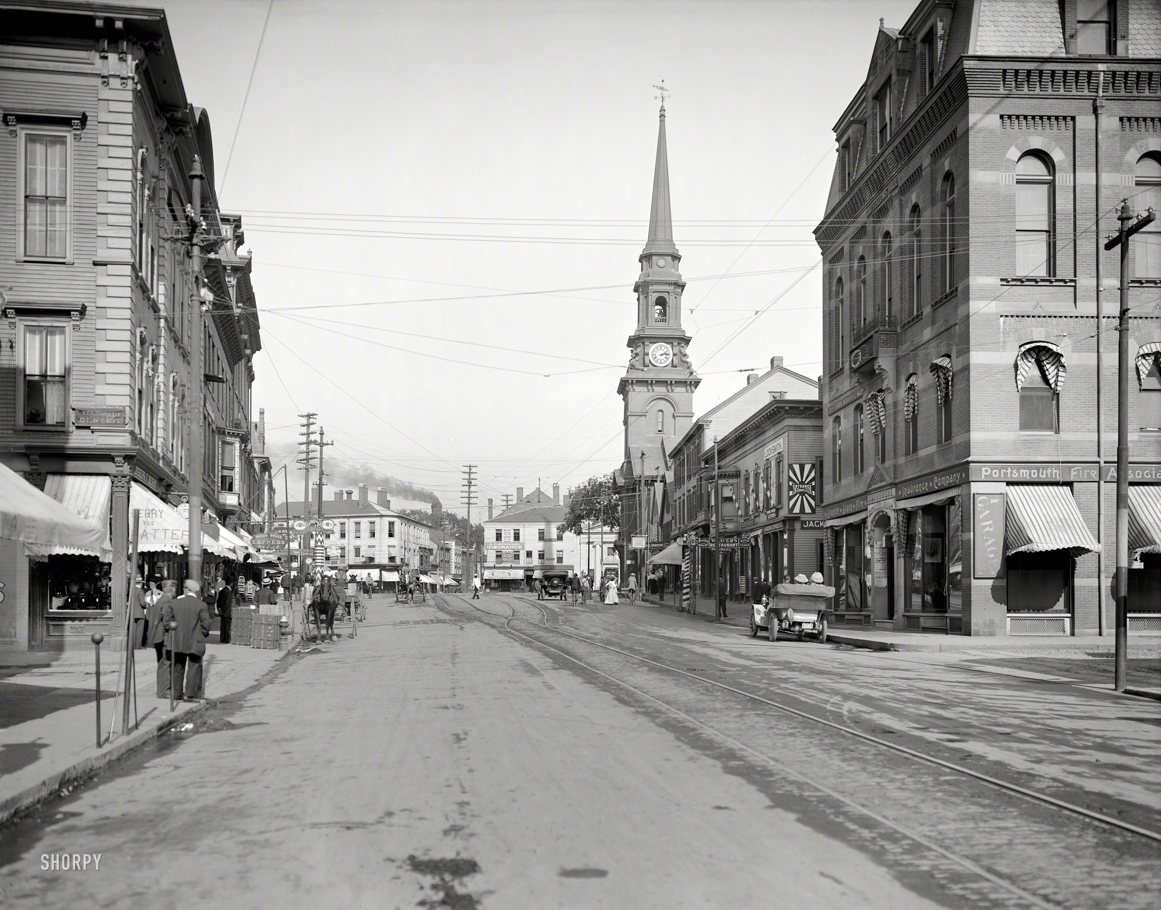 Portsmouth, New Hampshire, circa 1909. "Congress Street near Market Square." With at least two painless dentists, an optician, hatter and oyster house among the merchants vying for your trade. 8x10 inch glass negative. View full size.