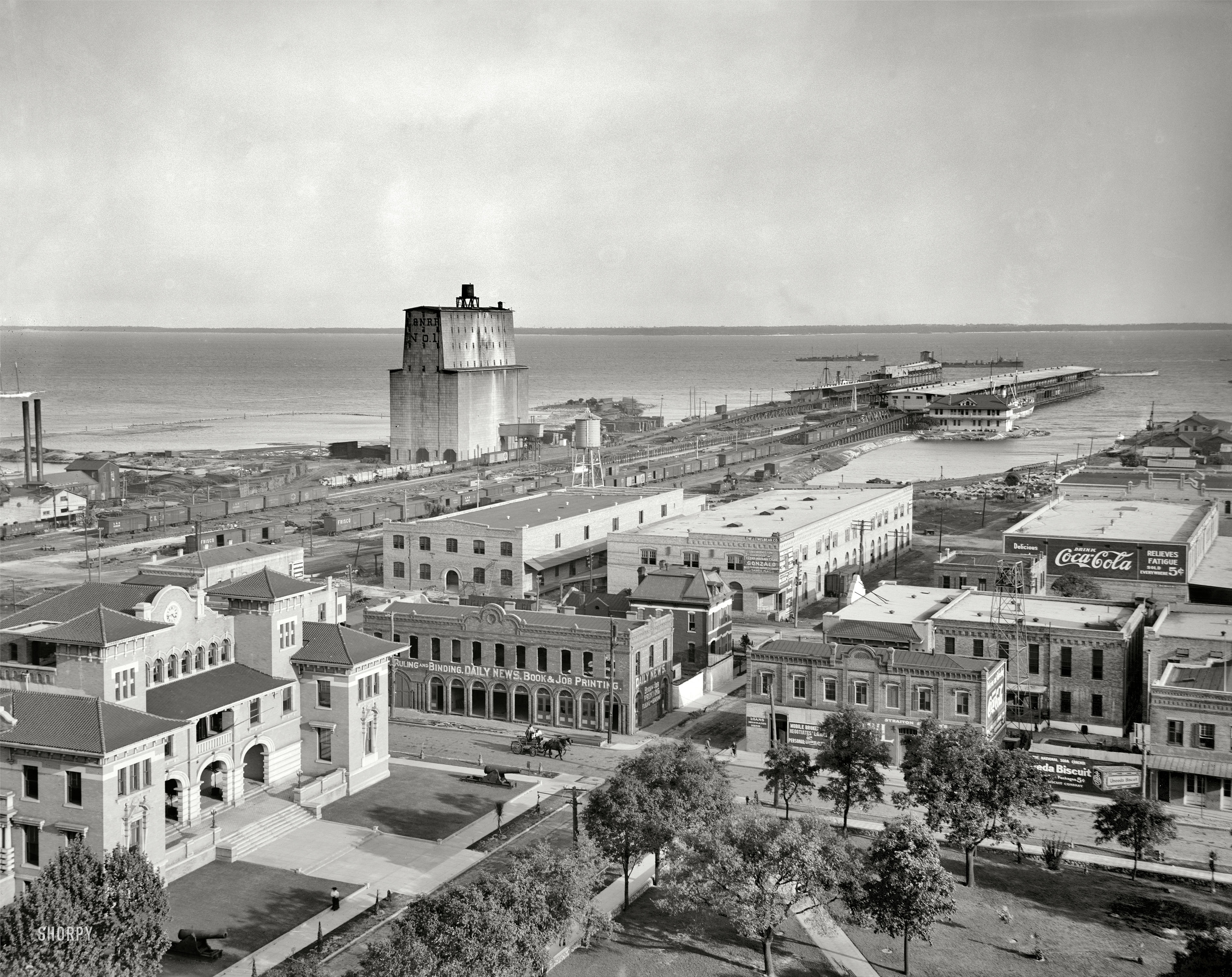 Circa 1910 comes this most agreeable vista. Who'll be the first commenter to put a name to a place? (Hint: Half the answer is already here.) View full size.
UPDATE: As many commenters correctly surmised, the city is Pensacola, Florida. The original caption: "Tarragona Street wharf, Pensacola, Florida."