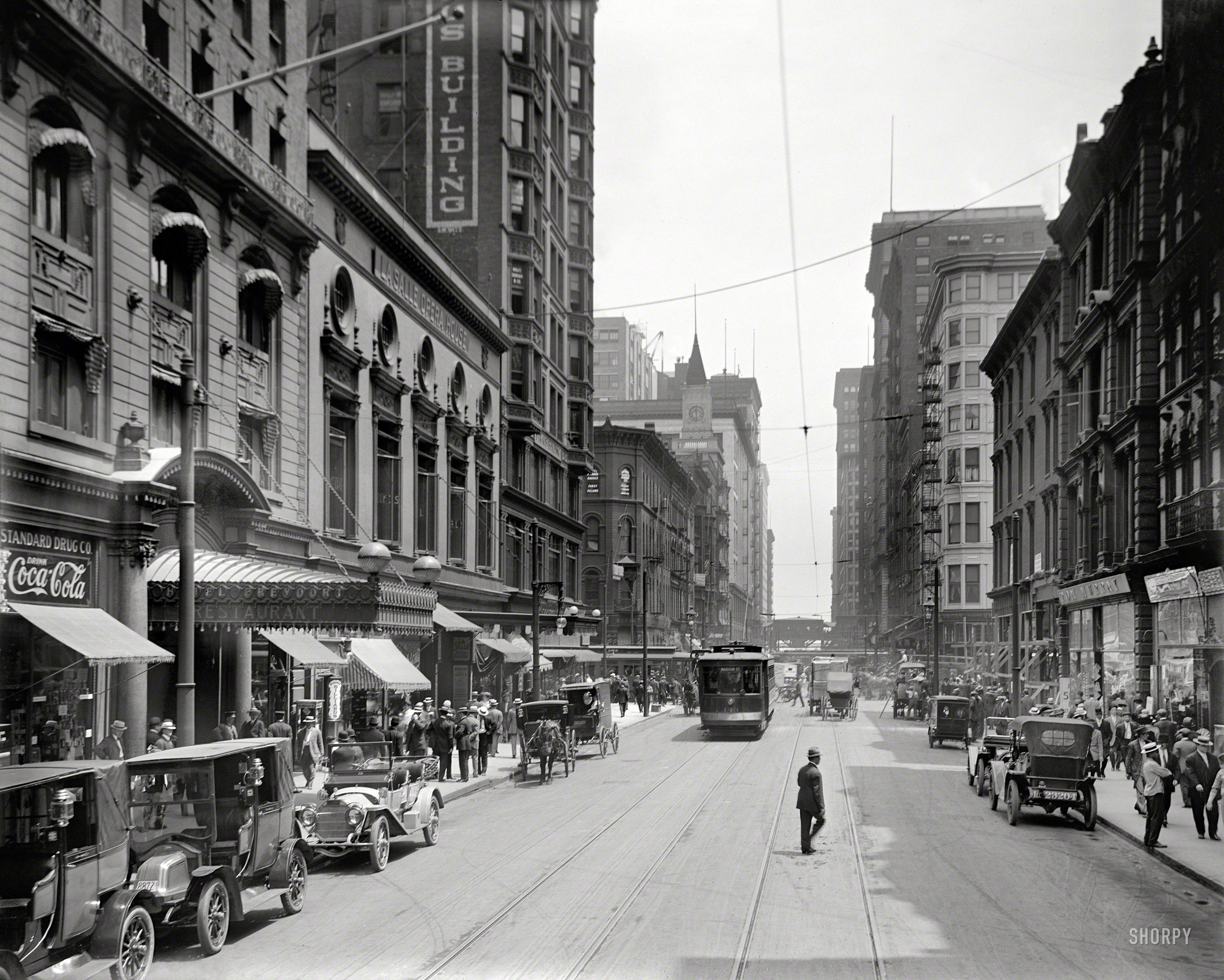 Chicago circa 1910. "Madison Street, Hotel Brevoort & La Salle Opera House." The fad for automobiles seems to be growing. 8x10 inch glass negative. View full size.