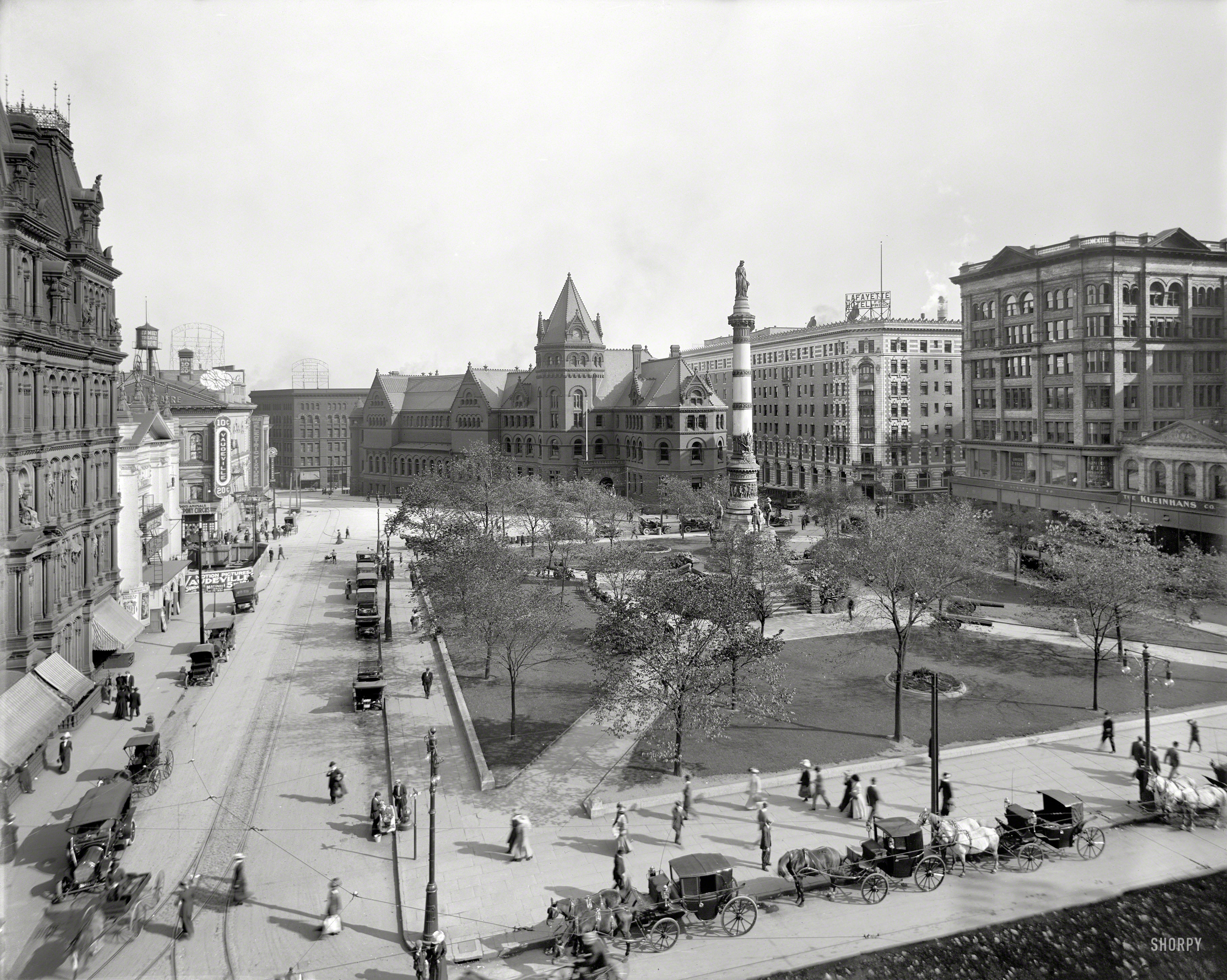 Buffalo, New York, circa 1911. "Lafayette Square." Where amusements include Motion Pictures, Vaudeville, a Pony Circus and, for the more practical-minded, Gas & Electric Fixtures. 8x10 inch glass negative. View full size.