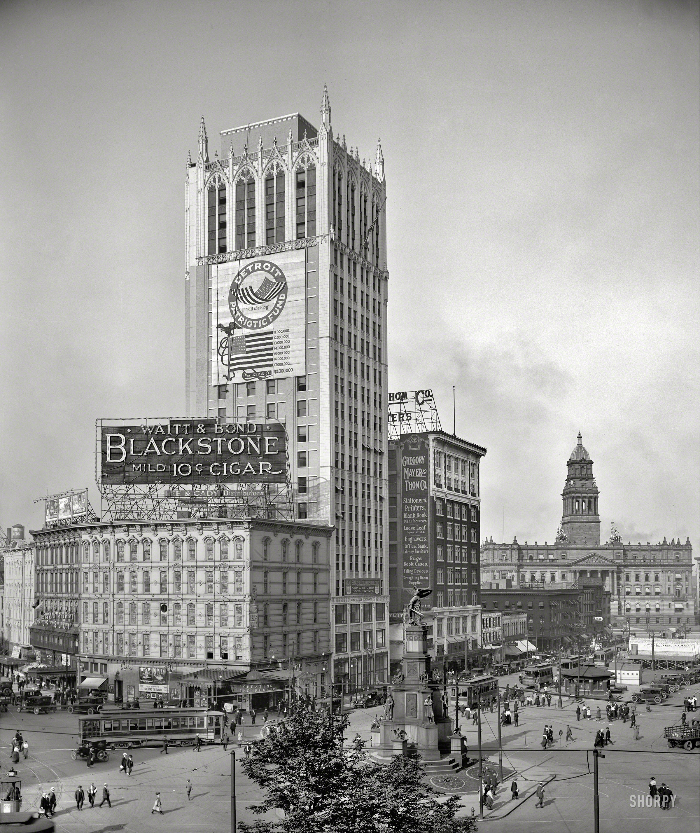Detroit, 1918. "Cadillac Square and Real Estate Exchange from City Hall." Also a view of the Soldiers' and Sailors' Monument with World War I patriotic signage as the backdrop. Now playing at the corner movie palace: the "cinemelodrama" Cheating the Public. 8x10 inch dry plate glass negative. View full size.