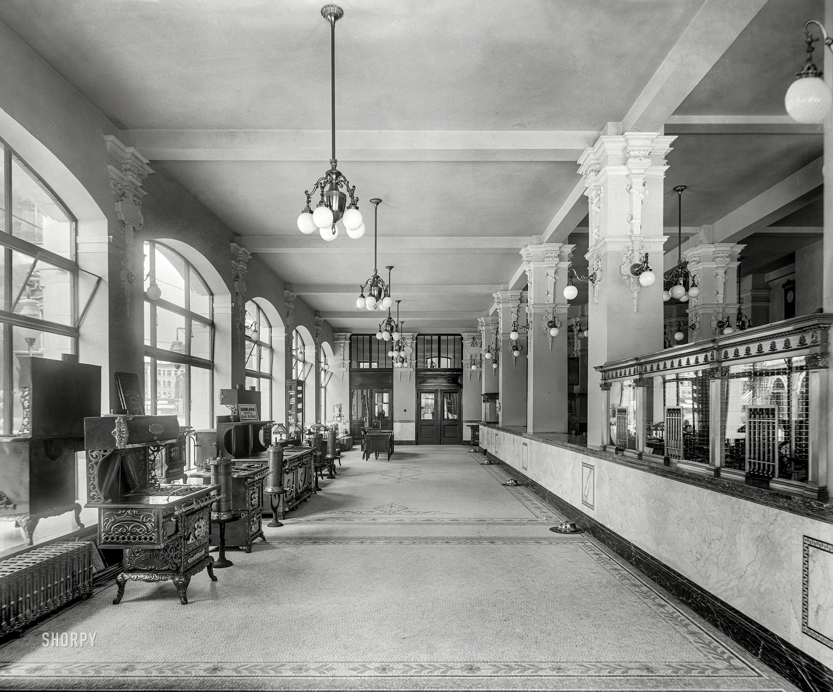 Detroit circa 1908. "Gas office, first floor, looking back; cashier windows at right." The lobby of the Detroit City Gas Company. 8x10 inch glass negative, Detroit Publishing Co. View full size.