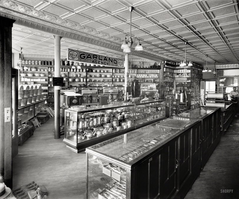 Detroit circa 1910. "Pickard Gas Co. -- Store interior with gaslight fixtures and Garland Agency display of stoves." One-stop shopping for washtubs, teakettles and croquet sets. 8x10 glass negative, Detroit Publishing Co. View full size.
