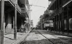 "Street in the French Quarter, New Orleans." At left, the portrait studio of photographer Louis Interguglielmi, 227 Royal Street. 5x7 glass negative, taken sometime between 1880 and 1898 by William Henry Jackson. View full size.