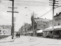 1906. "Twenty-Eighth Street, Newport News, Virginia." The go-to place for gadgets like gramophones and "Kodaks." 5x7 inch dry plate glass negative. View full size.