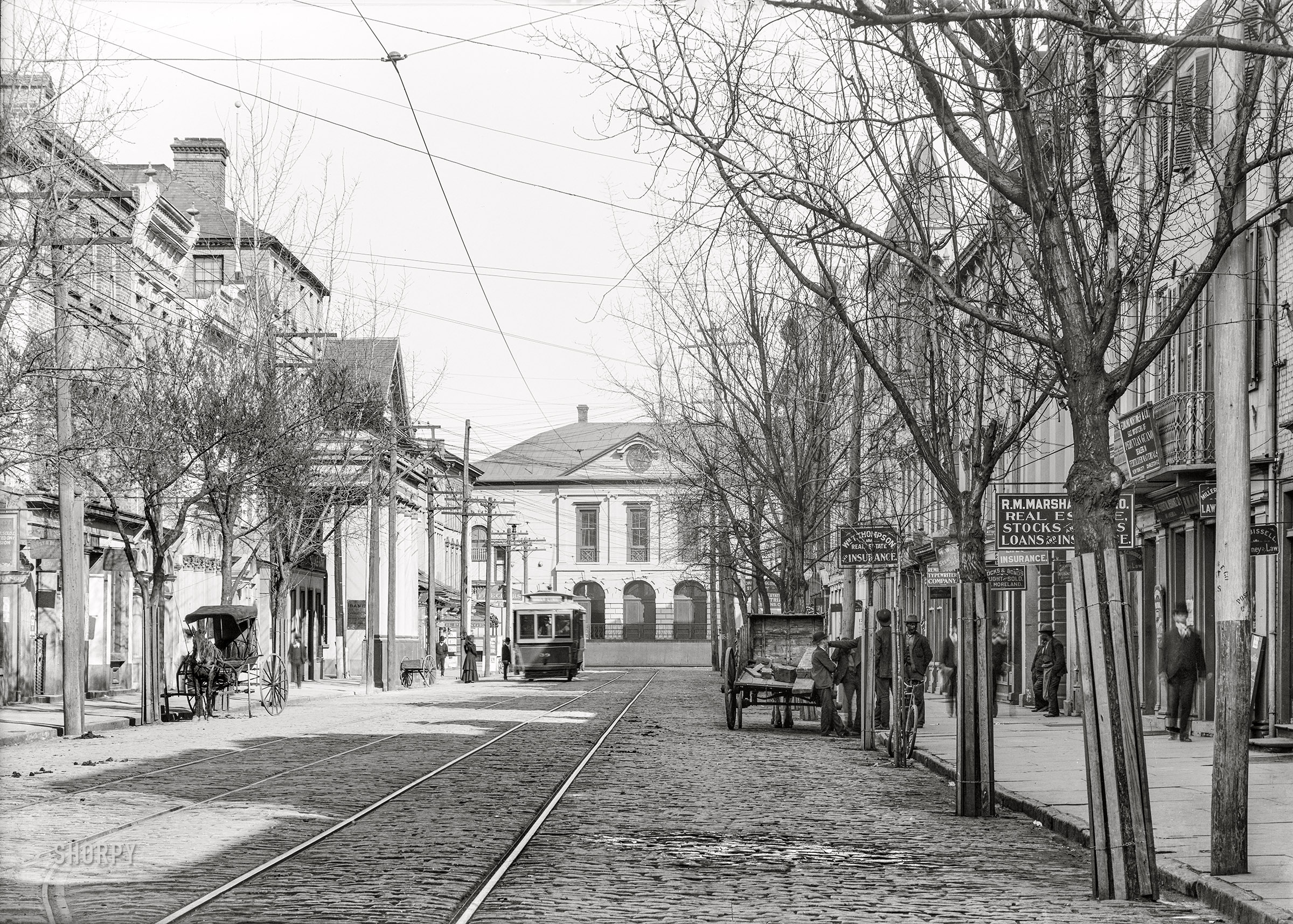 1906. Charleston, South Carolina. "East Broad Street." With a view of the Exchange Building & Custom House. 5x7 inch dry plate glass negative, Detroit Publishing Company. View full size.