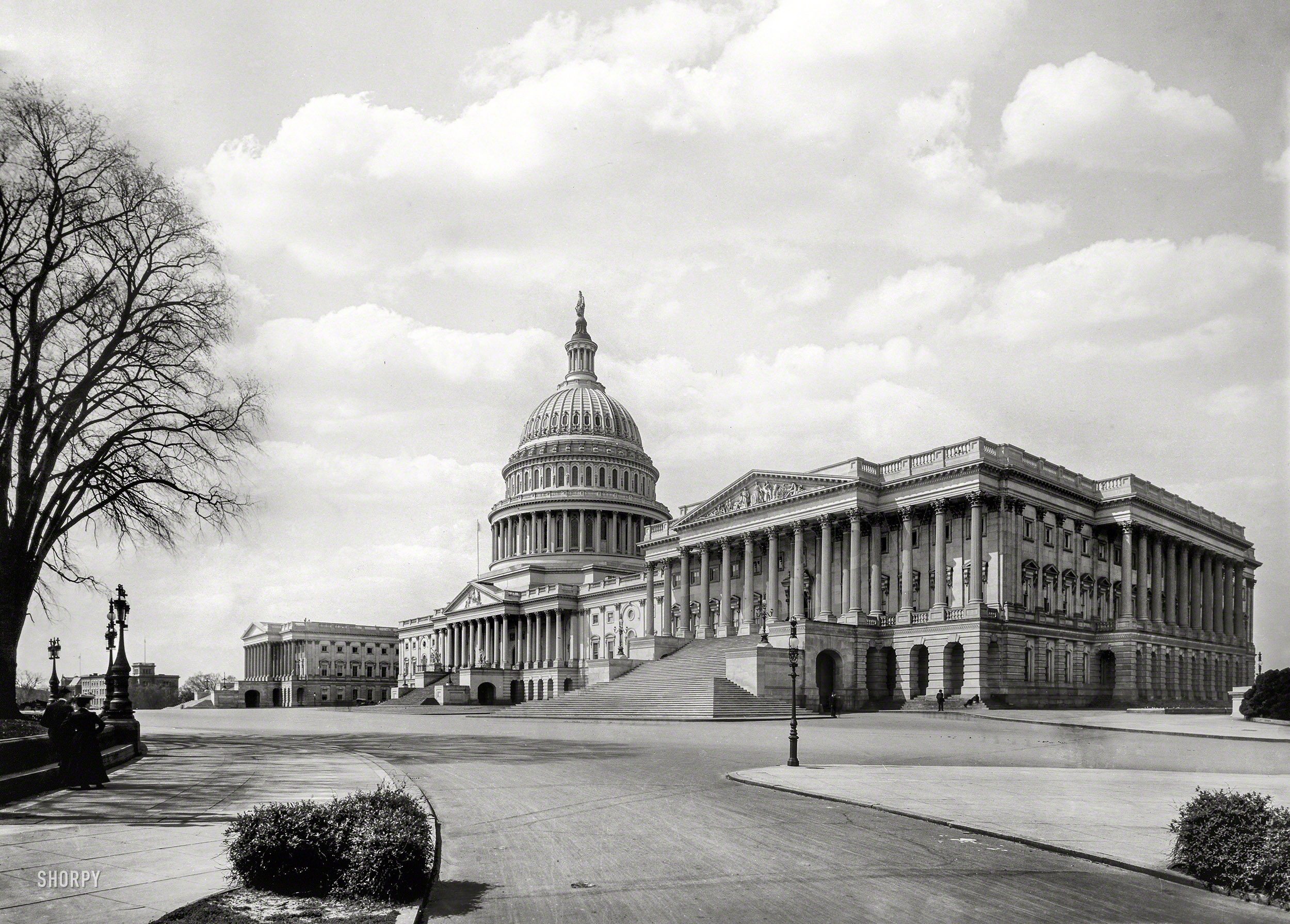 Circa 1905. "The Capitol at Washington -- East Front." The Senate wing is closest to the camera, with Thomas Crawford's sculpture The Progress of Civilization decorating the pediment atop the portico; the House of Representatives pediment at far left is blank; it would eventually be filled by Paul Bartlett's sculpture Apotheosis of Democracy, dedicated in 1916. 8x10 glass negative. View full size.
