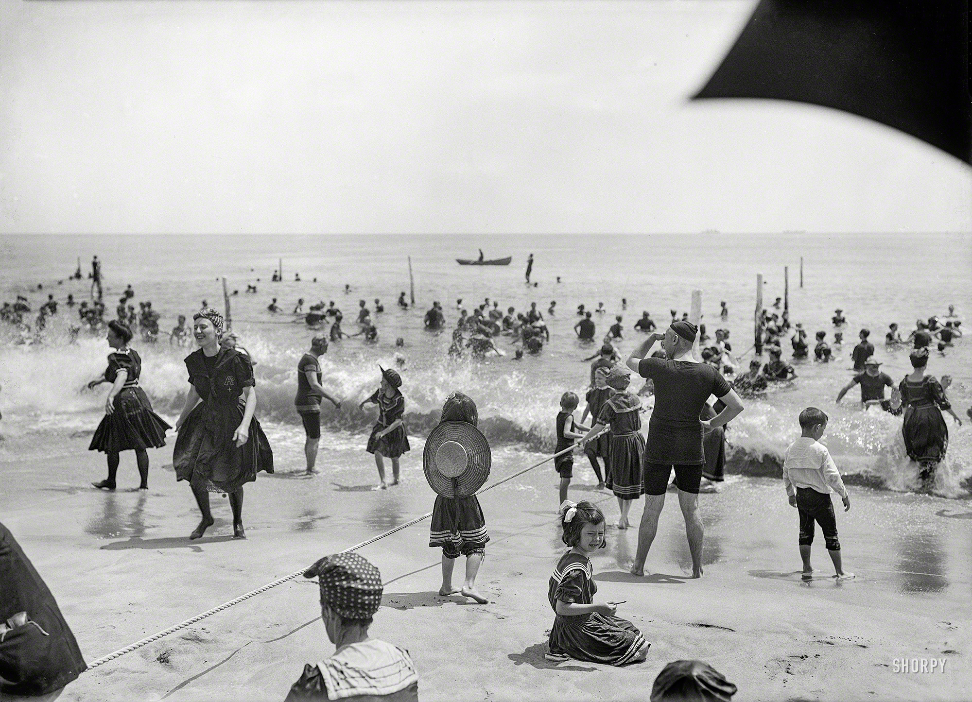 Circa 1910. "Surf bathers at crowded beach, possibly Atlantic City." 8x10 inch dry plate glass negative, Detroit Publishing Company. View full size.