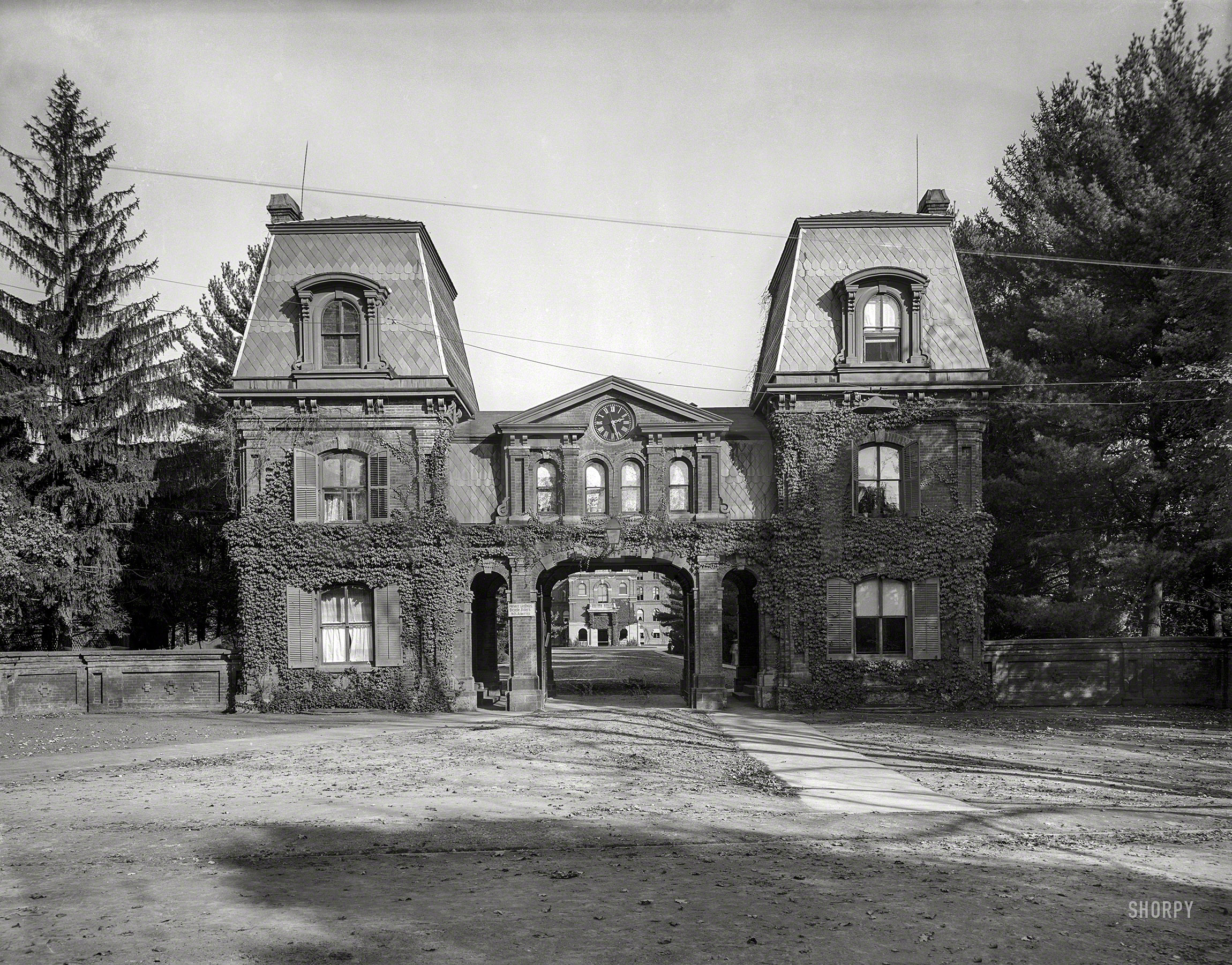 Poughkeepsie, N.Y., circa 1904. "The entrance, Vassar College." Note the sign. 8x10 inch glass transparency, Detroit Publishing Company. View full size.