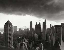 August 29, 1950. "Storm over Manhattan. New York: The towering buildings of Manhattan are silhouetted against heavy clouds which gathered over the city just before a sudden electrical rainstorm late in the afternoon of Aug. 29. This view looks south from the area of Central Park." Acme Newspicture. View full size.