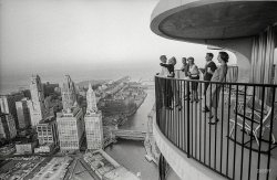 October 1963. "John and Sandy Dienhart of Chicago at their Marina City high-rise apartment -- the couple entertaining on their 60th-floor balcony." From photos for the Look magazine assignment "Living on the Top." View full size.