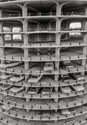 October 1963. "Cars in parking garage at base of Marina Towers high-rise apartment building, Chicago." 35mm acetate negative from photos for the Look magazine assignment "Living on the Top." View full size.