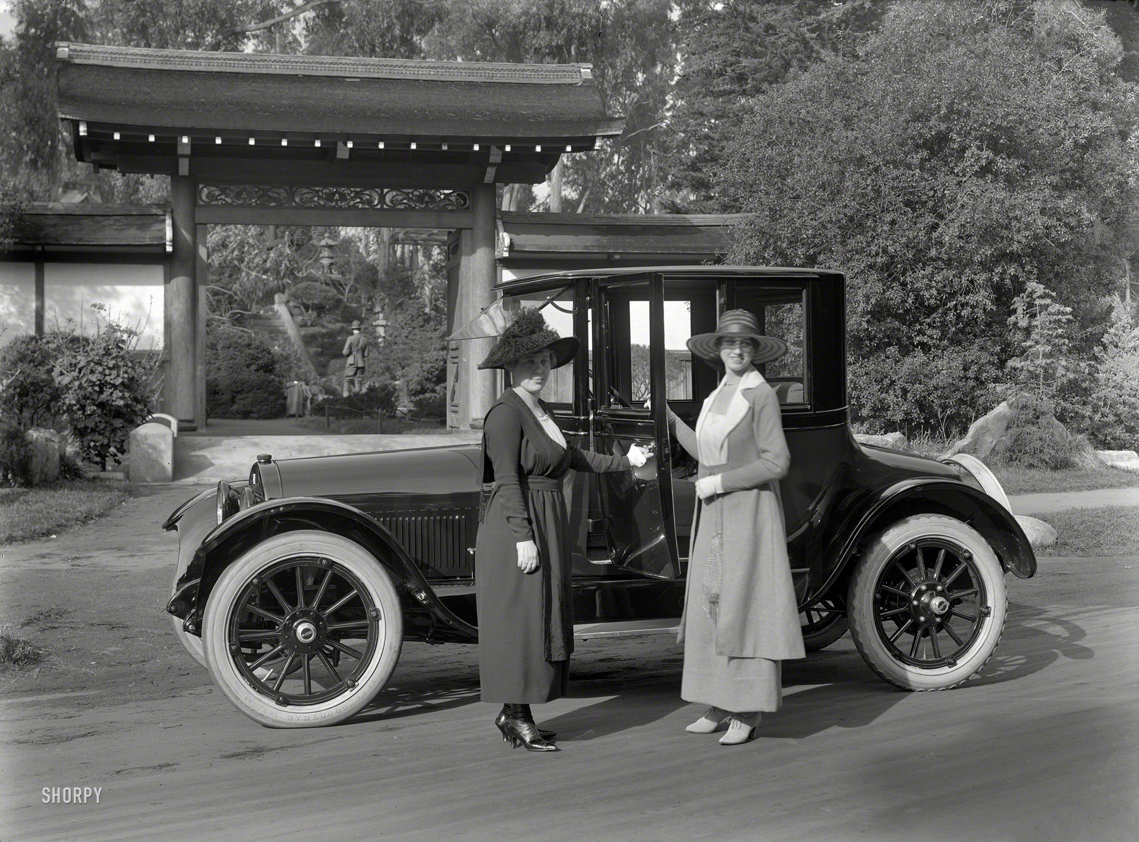 San Francisco. 1918. "Buick at Japanese Tea Garden, Golden Gate Park." Domina&shy;trix footwear on the left. 5x7 glass negative by Christopher Helin. View full size.