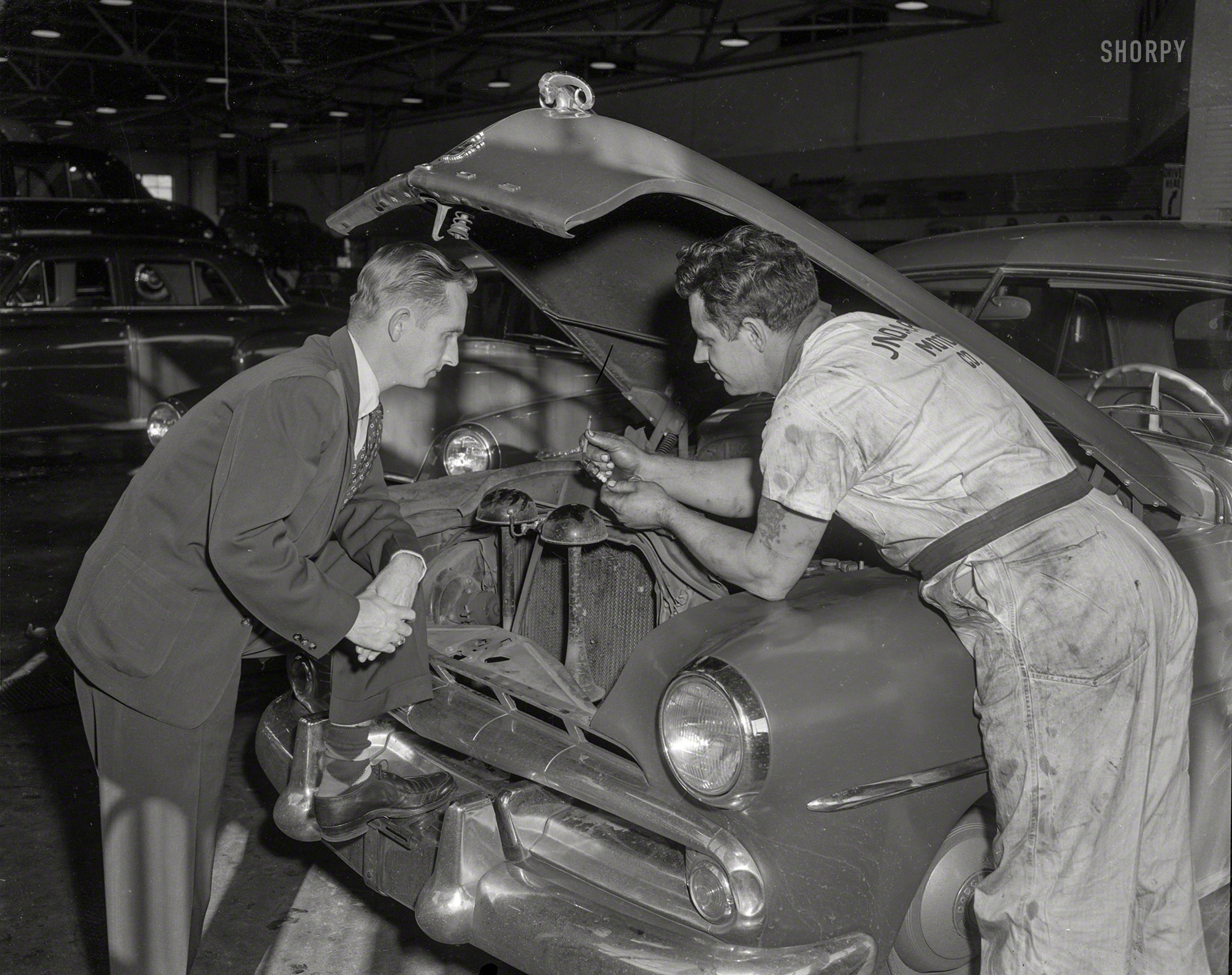 &nbsp; &nbsp; &nbsp; &nbsp; "So as you can see, Mr. Smith, pencils and spark plugs are not interchangeable."
Columbus, Georgia, circa 1952. "Pope Motor Co. service garage." 4x5 inch acetate negative from the Shorpy News Photo Archive. View full size.