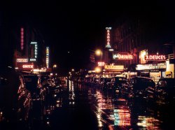 July 1948. 52nd Street in New York. "The Street is at its best at night, when the neons start to bloom. It loses some of its carnival atmosphere when daylight dims its gaudy luster." Kodachrome by William Gottlieb for Collier's magazine. If anyone needs us, we'll be digging Harry the Hipster at the Onyx. View full size.