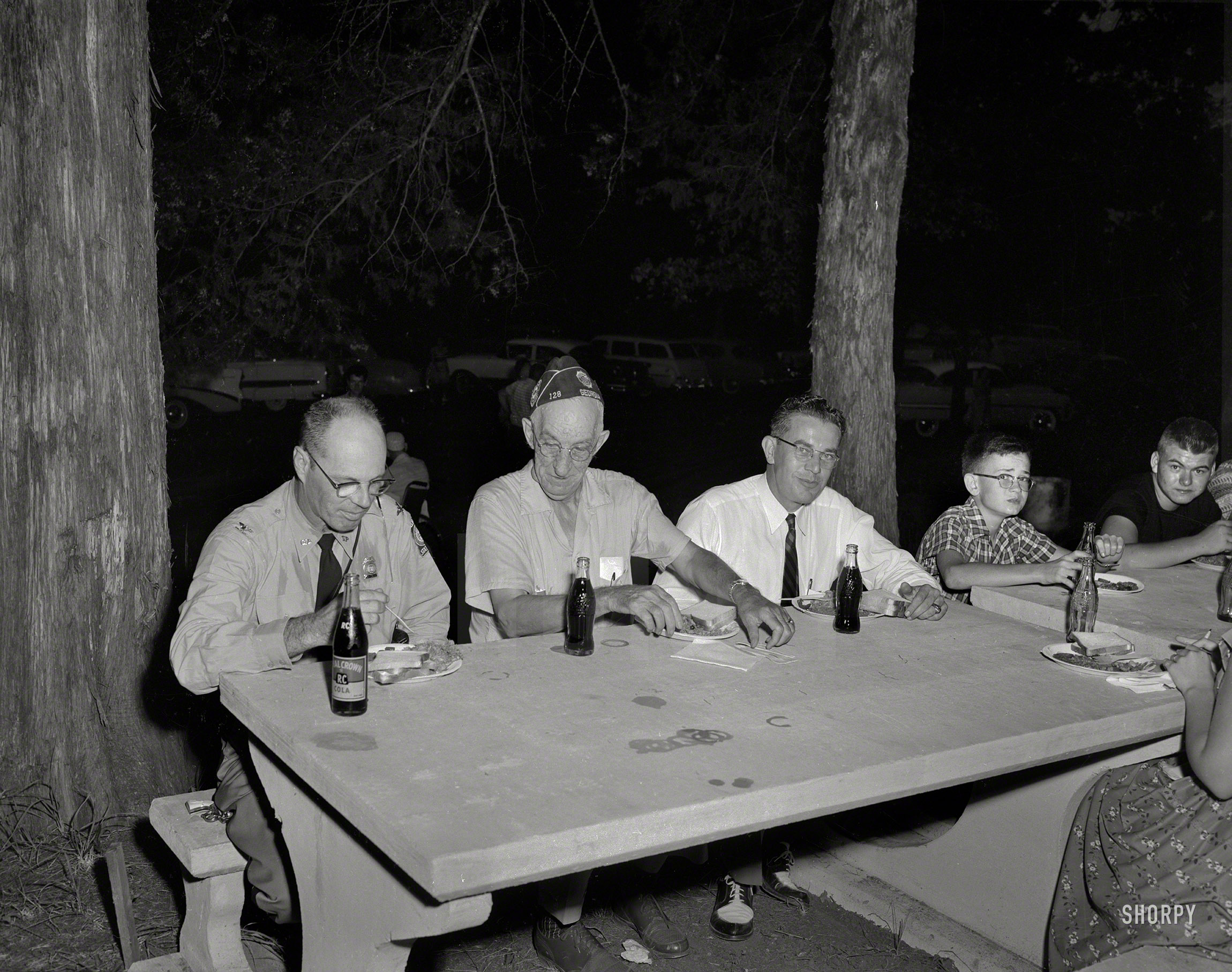 Columbus, Georgia, circa 1956. "Boys Club picnic." RC Cola outlier on the left, and he's armed. 4x5 acetate negative from the News Archive. View full size.